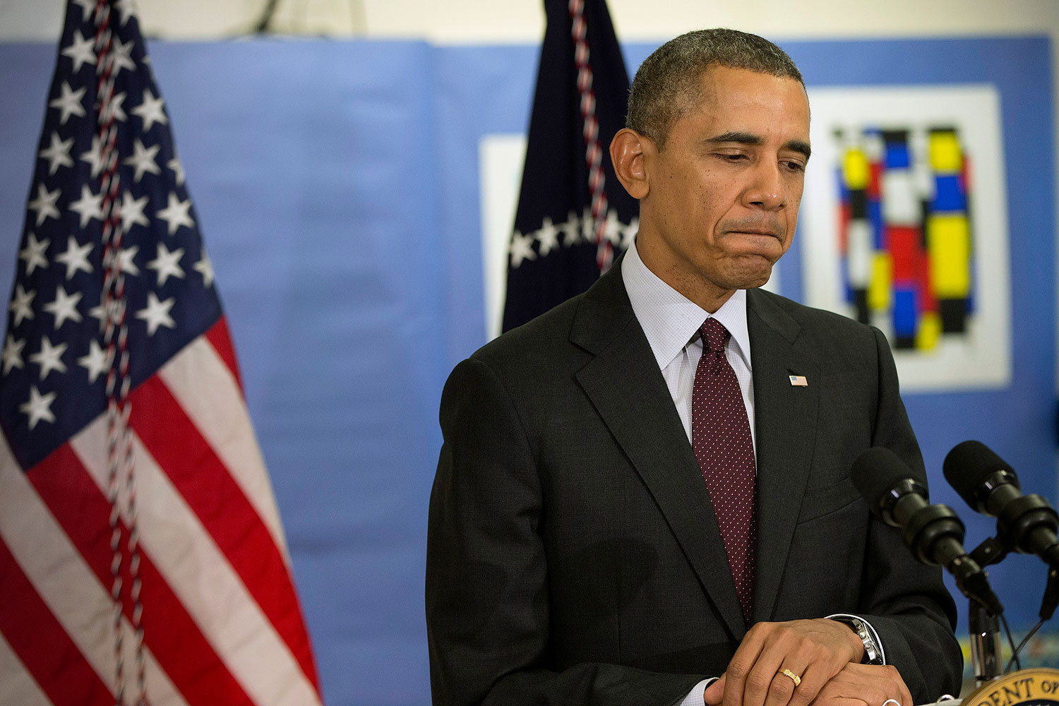 U.S. President Barack Obama pauses as he answers a question regarding the ongoing situation in Ukraine during his visits to Powell Elementary School in Washington, D.C., on March 4, 2014