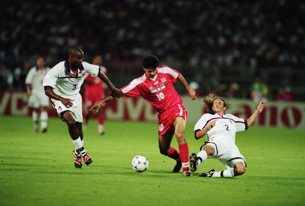 Ali Daei of Iran and Eddie Pope and Frankie Hejduk of the USA