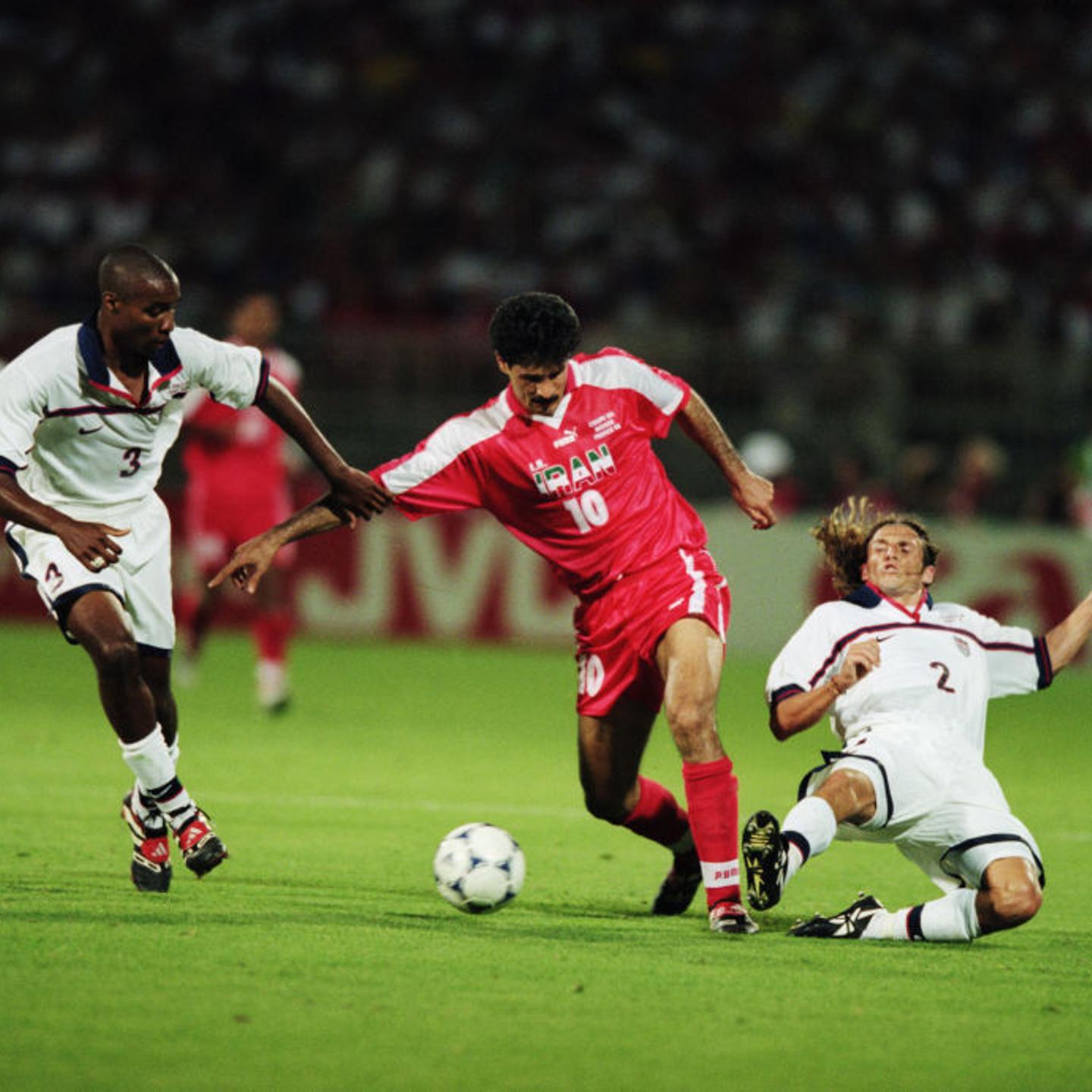 Ali Daei of Iran and Eddie Pope and Frankie Hejduk of the USA