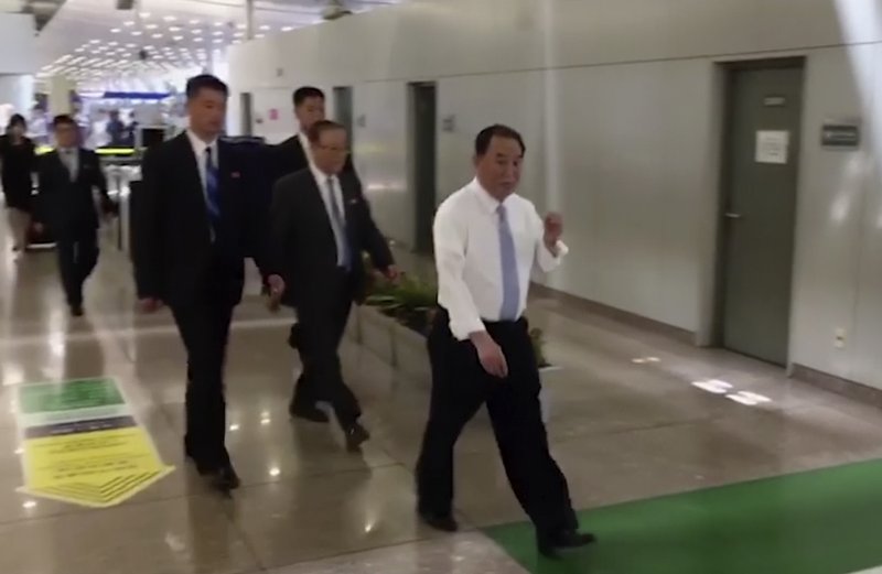 In this image made from video, Kim Yong Chol, in white, Kim Jong Un’s top official on inter-Korean relations, walks upon arrival at Beijing airport in Beijing on May 29, 2018.