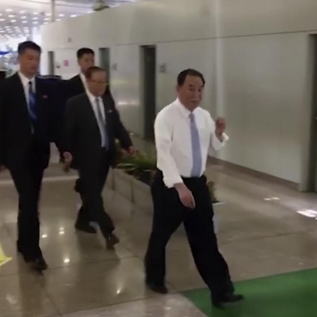 In this image made from video, Kim Yong Chol, in white, Kim Jong Un’s top official on inter-Korean relations, walks upon arrival at Beijing airport in Beijing on May 29, 2018.