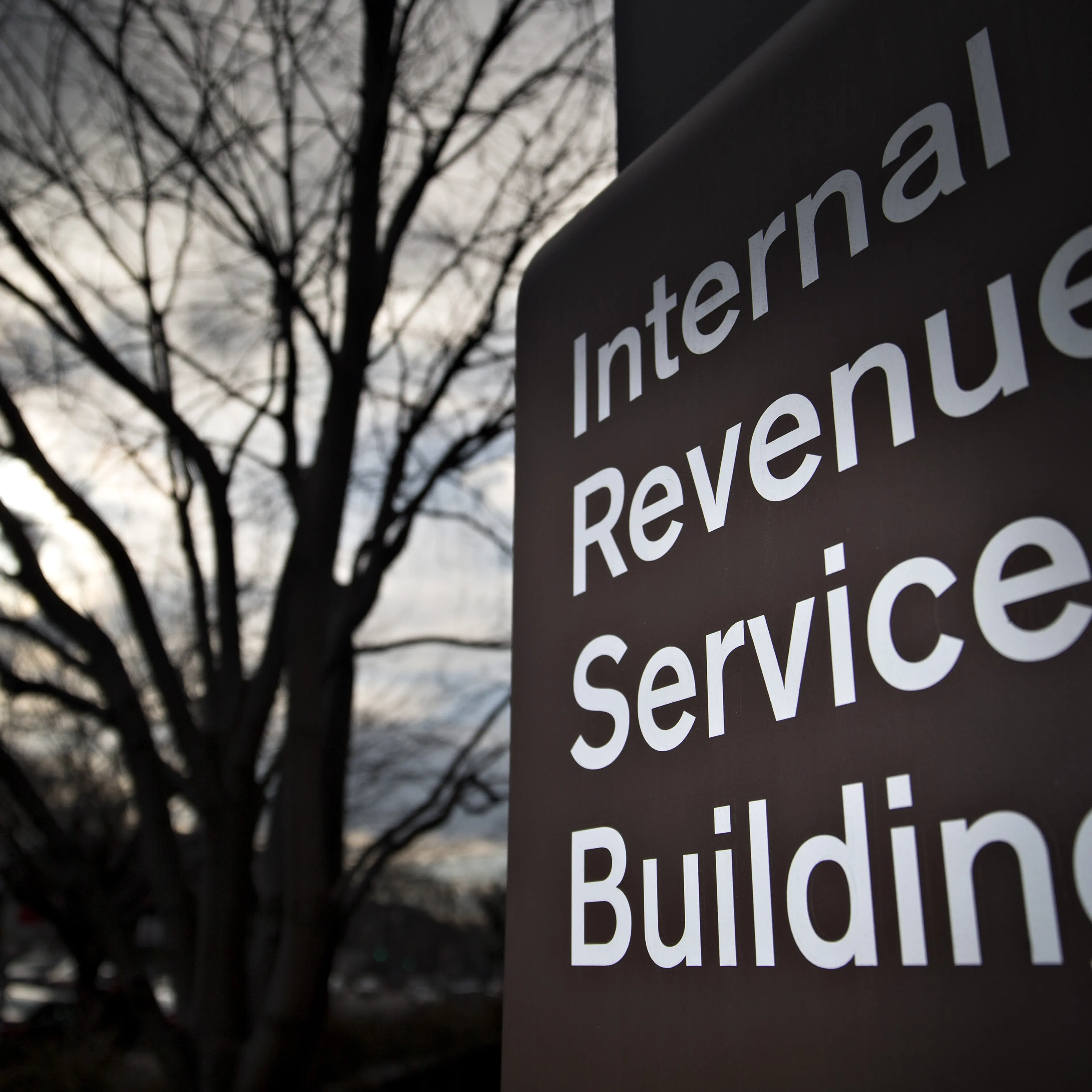 Signage for the Internal Revenue Service (IRS) stands outside the IRS headquarters building in Washington, D.C., U.S., on Wednesday, Feb. 17, 2016.
