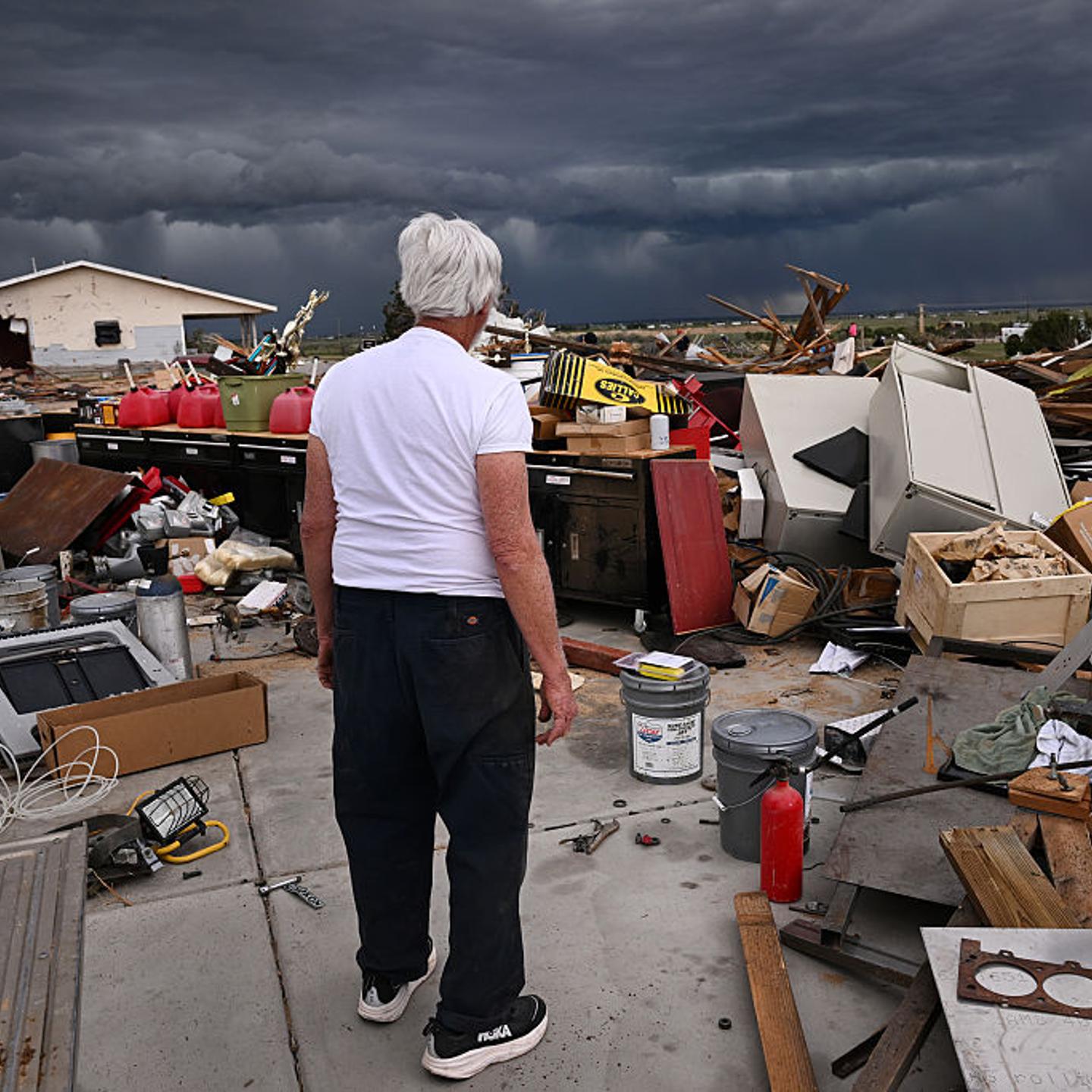 Mark Faber surveys the damage left behind from a large tornado that destroyed his house, garage and other structures in Bennett, Co. on May 19, 2025.