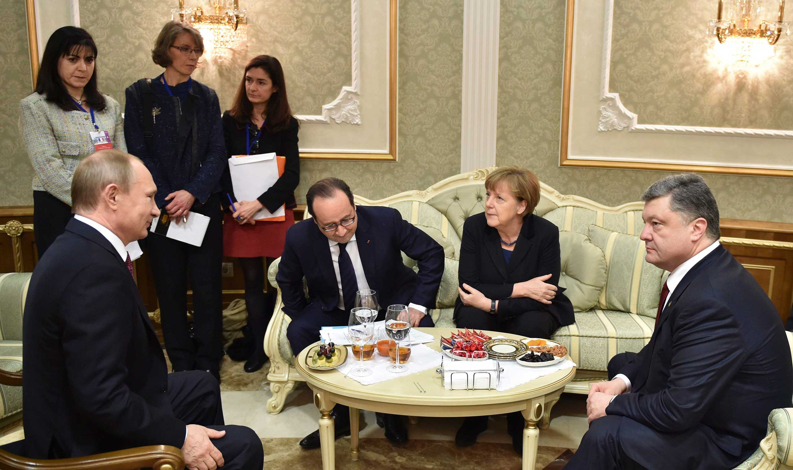 Russia's President Vladimir Putin, France's President Francois Hollande, Germany's Chancellor Angela Merkel and Ukraine's President Petro Poroshenko attend a meeting on resolving the Ukrainian crisis in Minsk, Belarus, Feb. 11, 2015.
