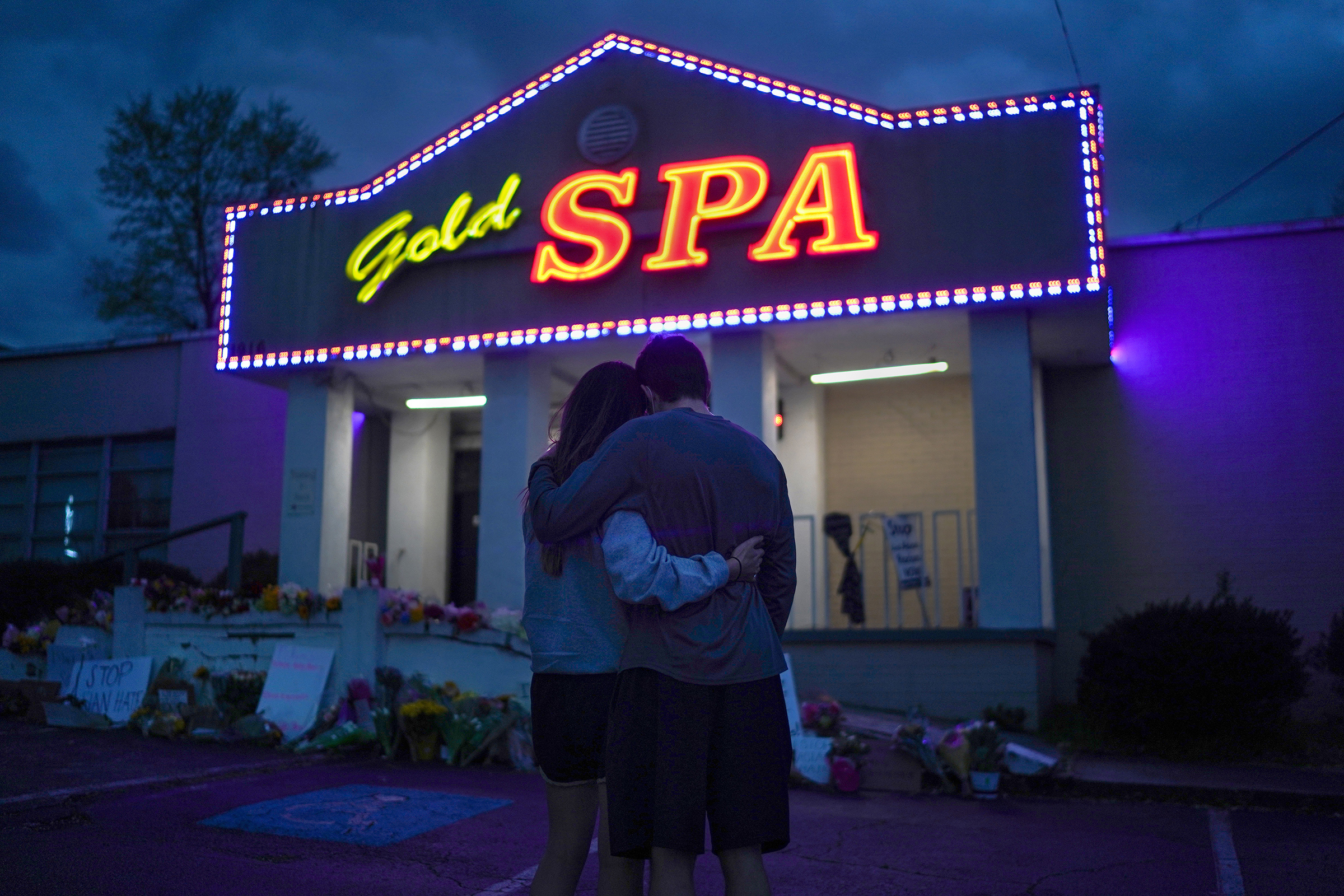 Cynthia Shi and her boyfriend, Graham Bloomsmith, embrace outside Gold Spa—one of the three Atlanta-area businesses where, two days earlier, a gunman fatally shot eight people, including six women of Asian descent—on March 18, 2021.