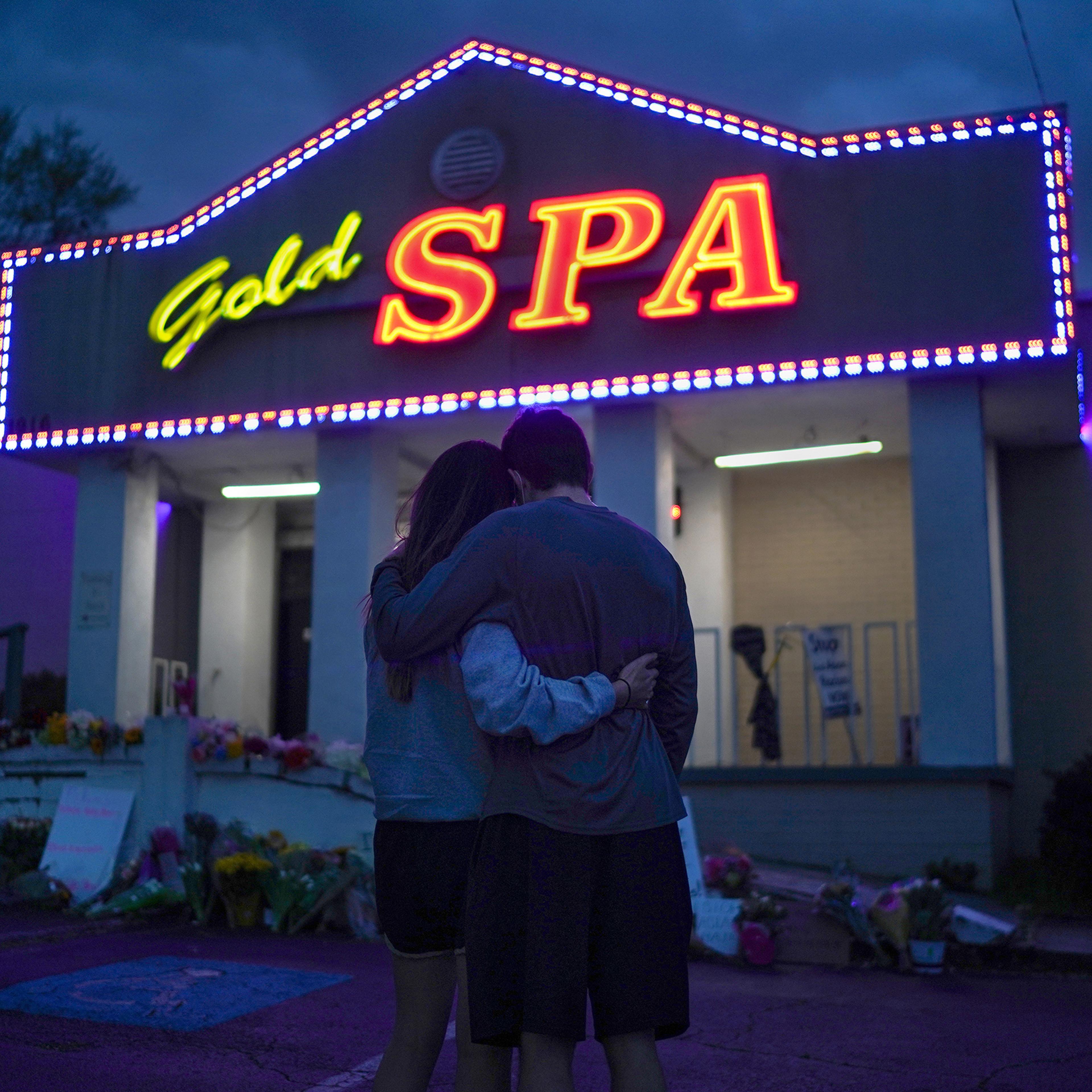 Cynthia Shi and her boyfriend, Graham Bloomsmith, embrace outside Gold Spa—one of the three Atlanta-area businesses where, two days earlier, a gunman fatally shot eight people, including six women of Asian descent—on March 18, 2021.