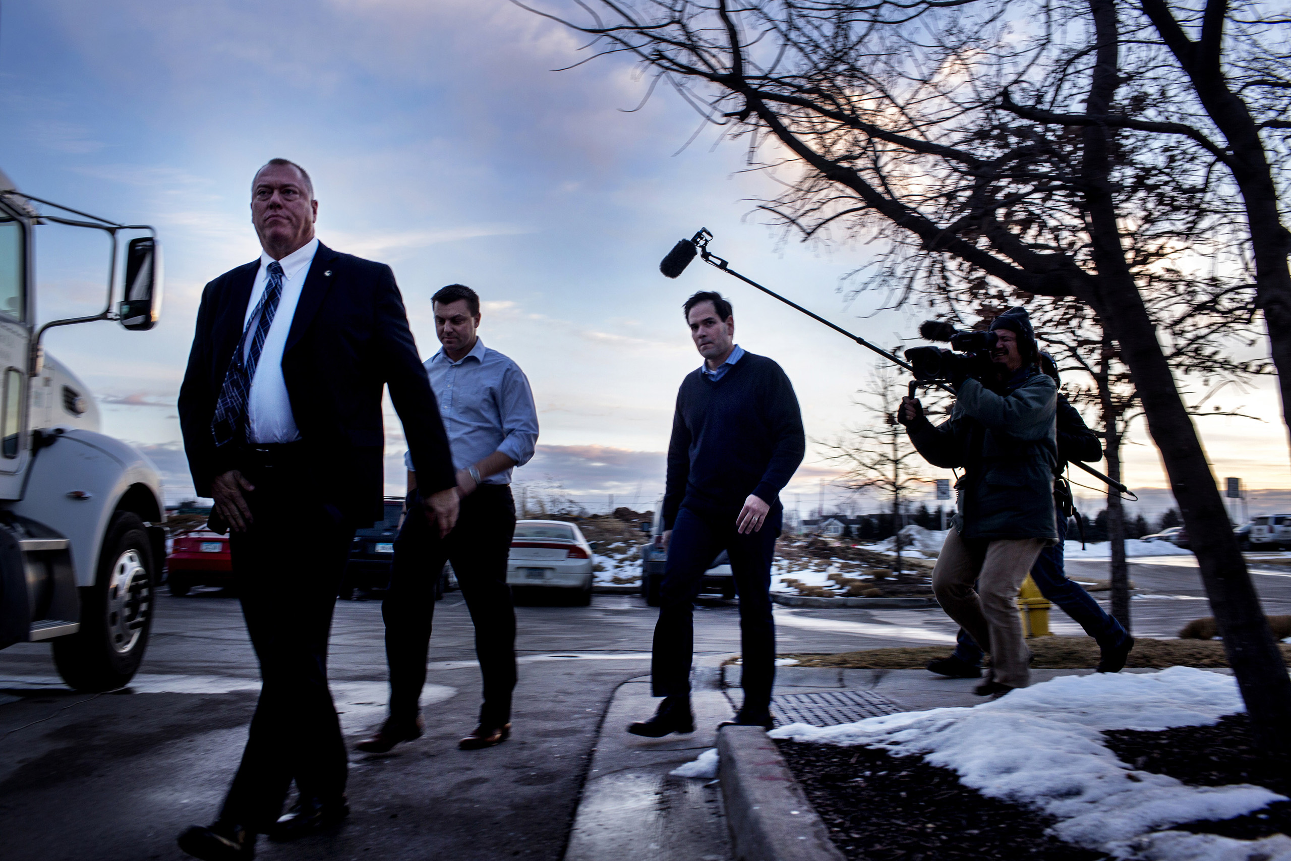 Rubio walks off his bus towards the pub. Marco Rubio spoke to supporters at a campaign rally at the Wellman's Pub and Rooftop in Des Moines Iowa on Wednesday evening, January 27th 2016. (Natalie Keyssar for TIME)