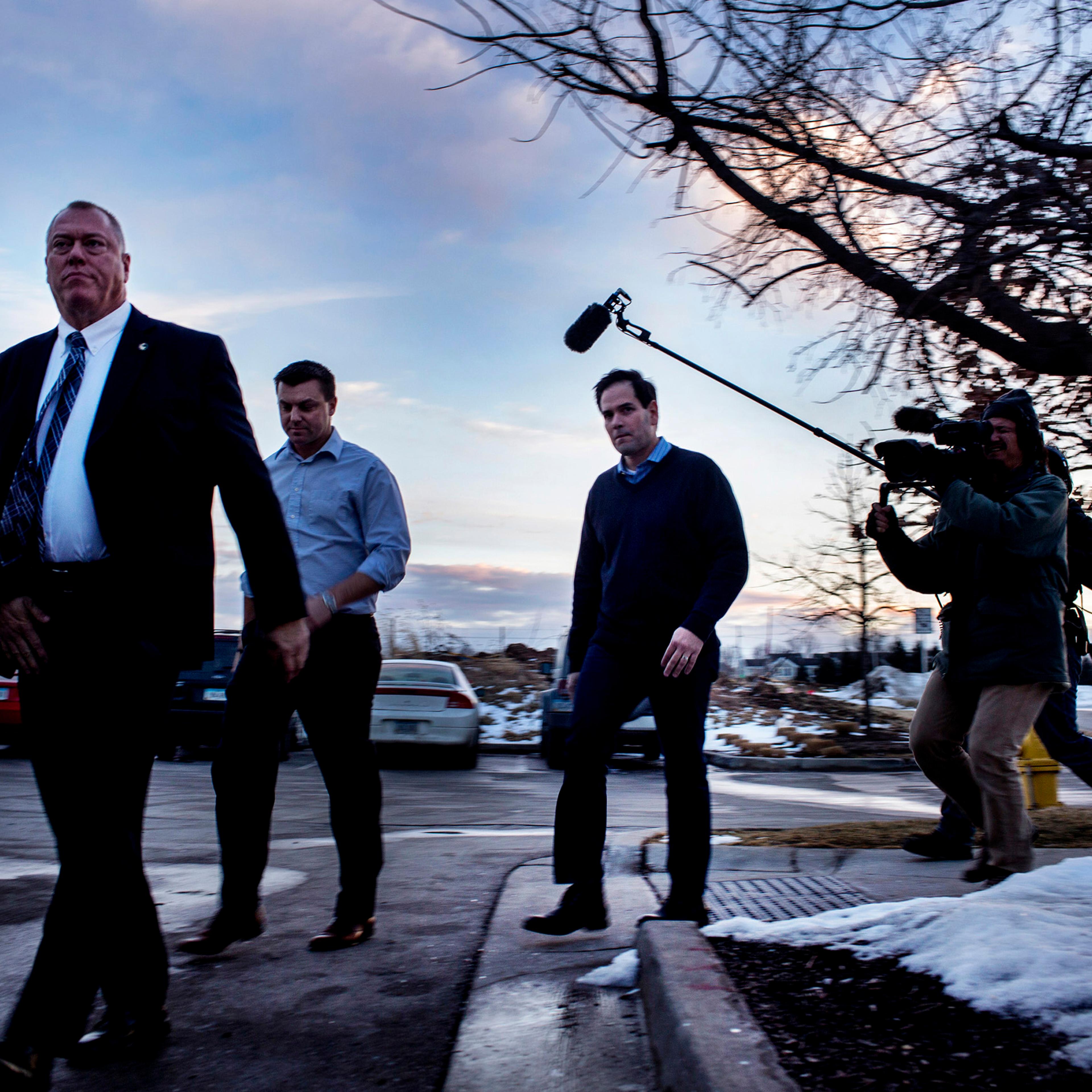 Rubio walks off his bus towards the pub. Marco Rubio spoke to supporters at a campaign rally at the Wellman's Pub and Rooftop in Des Moines Iowa on Wednesday evening, January 27th 2016. (Natalie Keyssar for TIME)