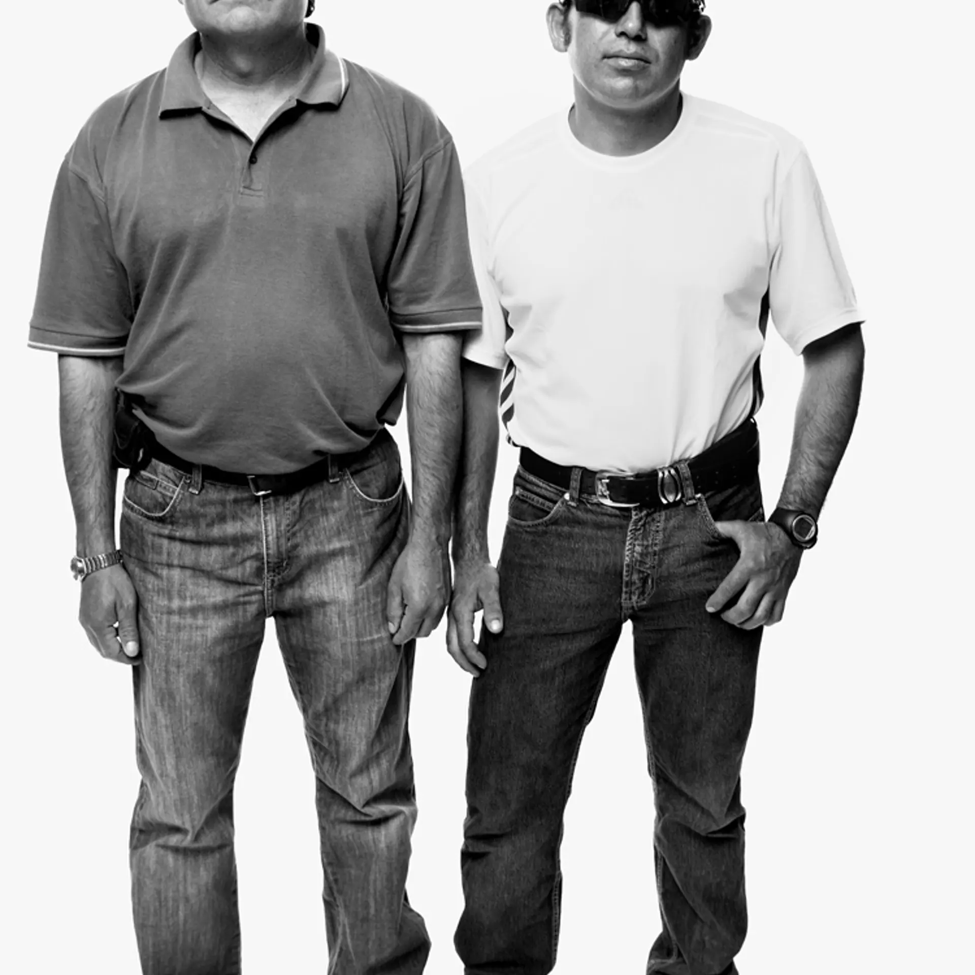 Pablo Rojas and Alex Vega wearing the sunglasses the miners wore to protect their eyes from the light when they emerged from the mine