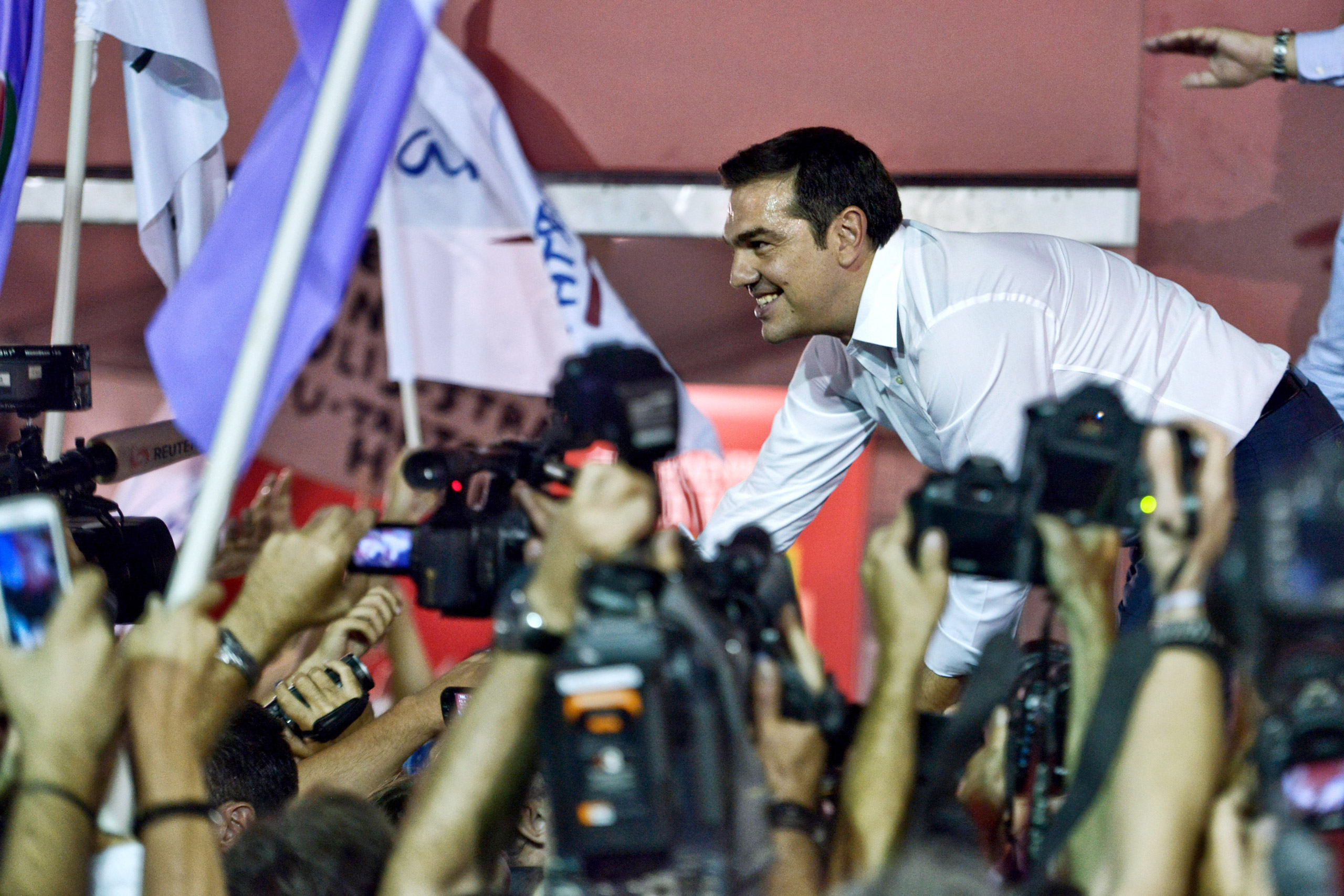 ATHENS, GREECE - SEPTEMBER 20: Former Greek prime minister and leader of leftist Syriza party Alexis Tsipras address supporters after winning the general election on September 20, 2015 in Athens, Greece. In Greece's fifth general election in six years, t