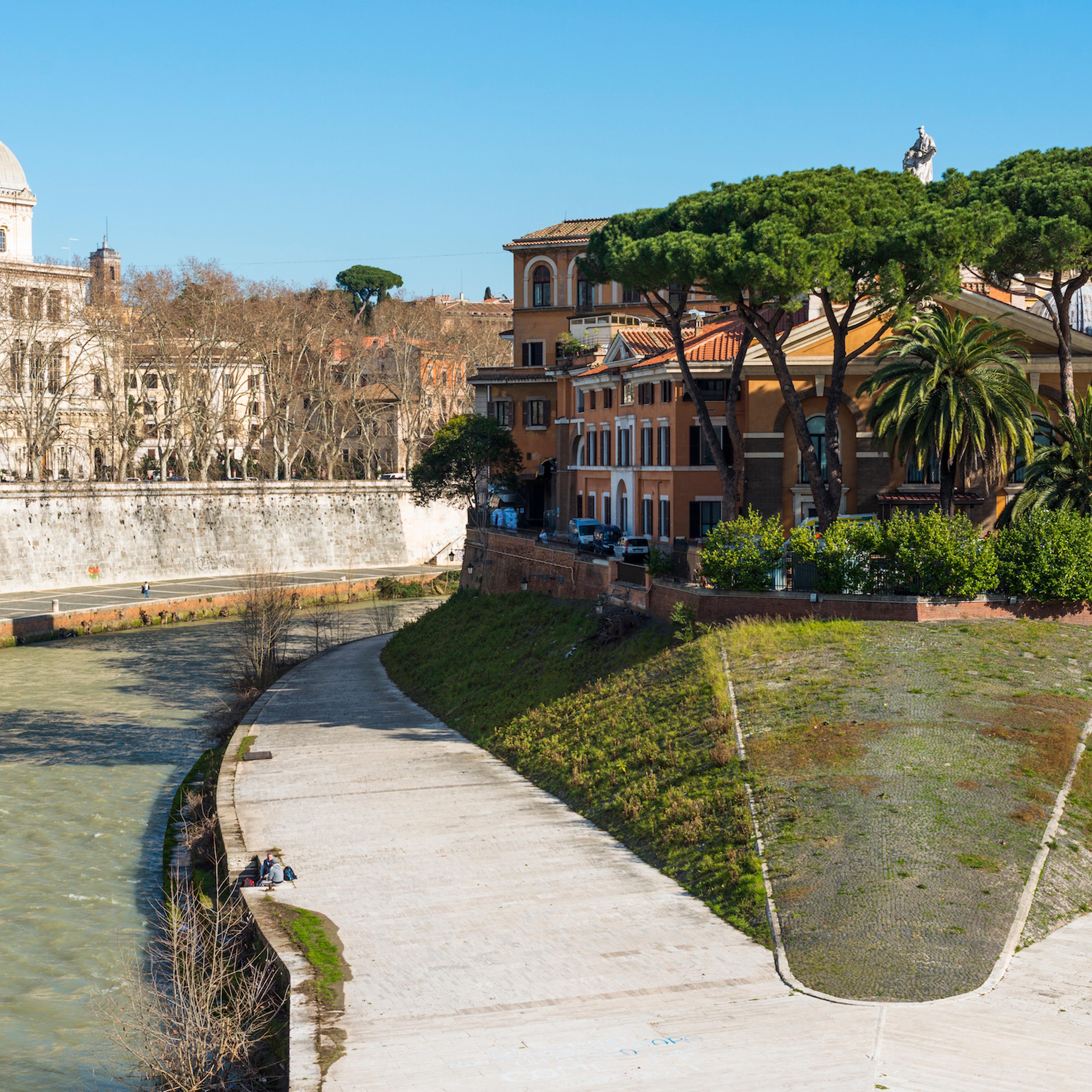 In the middle of Romes Tiber River is the small island Isola Tiberina Fatebenefratelli Hospital on western side Synagogue on left Lazio, Italy