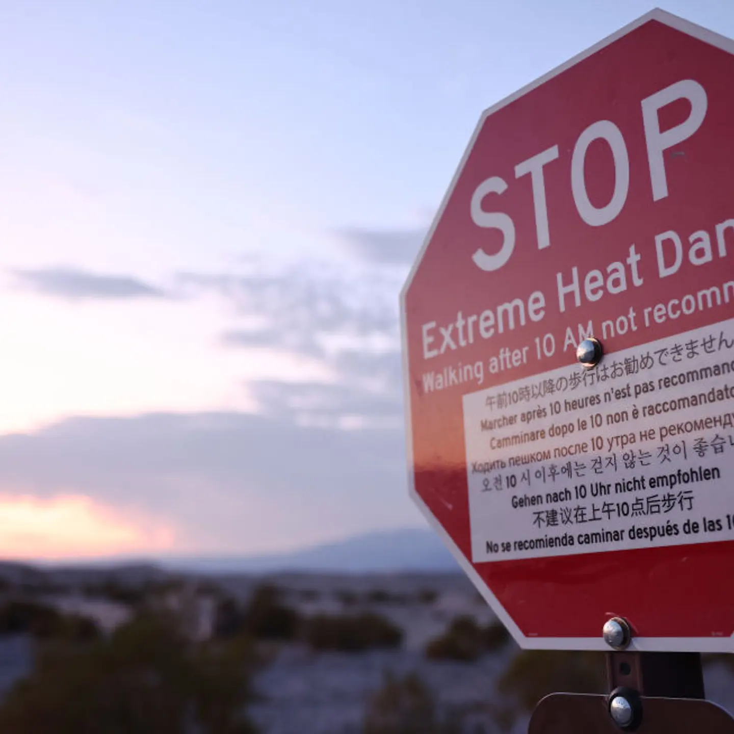 A 'Stop Extreme Heat Danger' sign is posted during a long-duration heat wave which is impacting much of California on July 8, 2024 in Death Valley National Park, California.