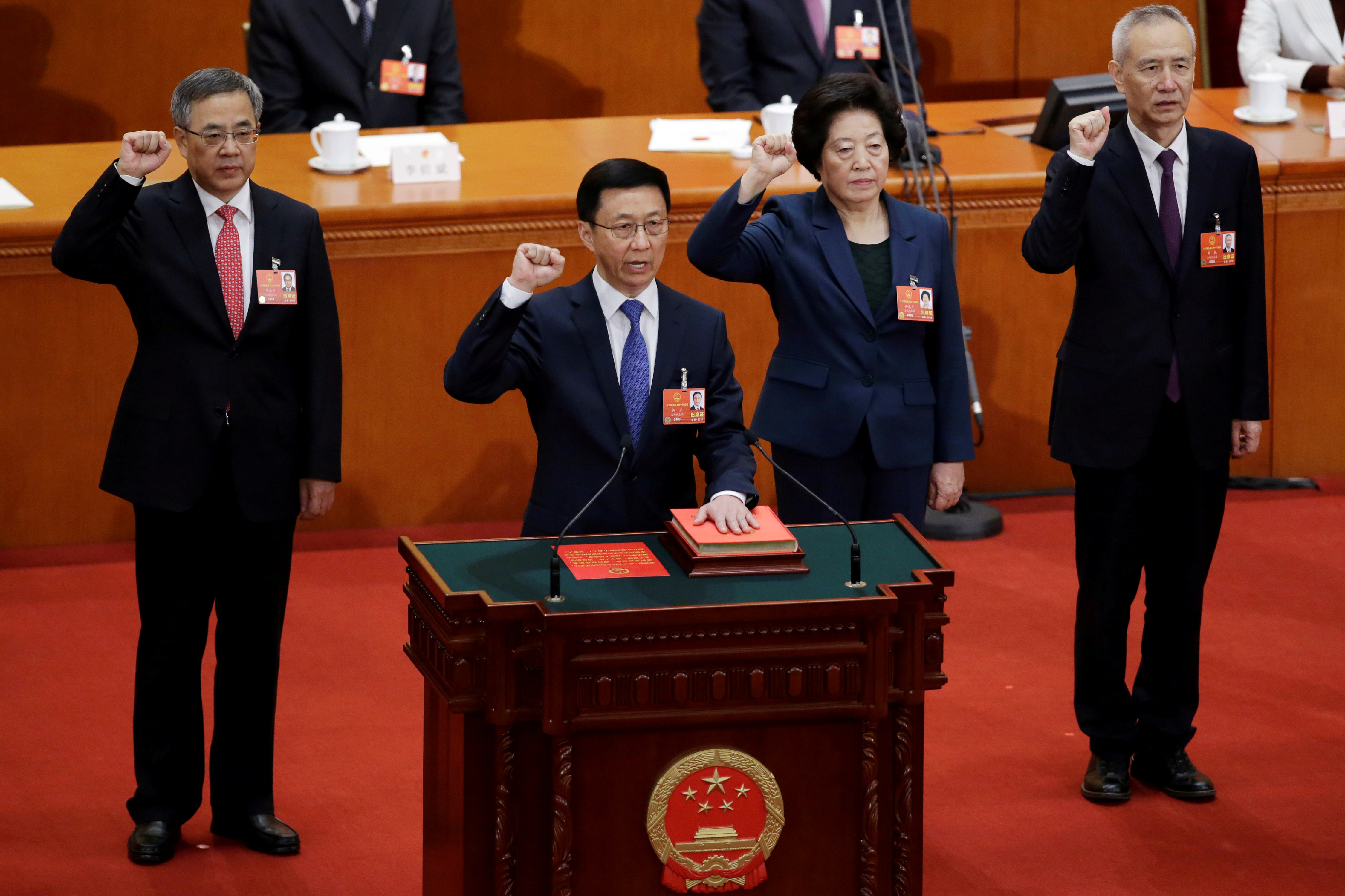 Newly elected Vice Premiers Hu Chunhua, Han Zheng, Sun Chunlan and Liu He take an oath to the constitution at the seventh plenary session of the National People's Congress (NPC)