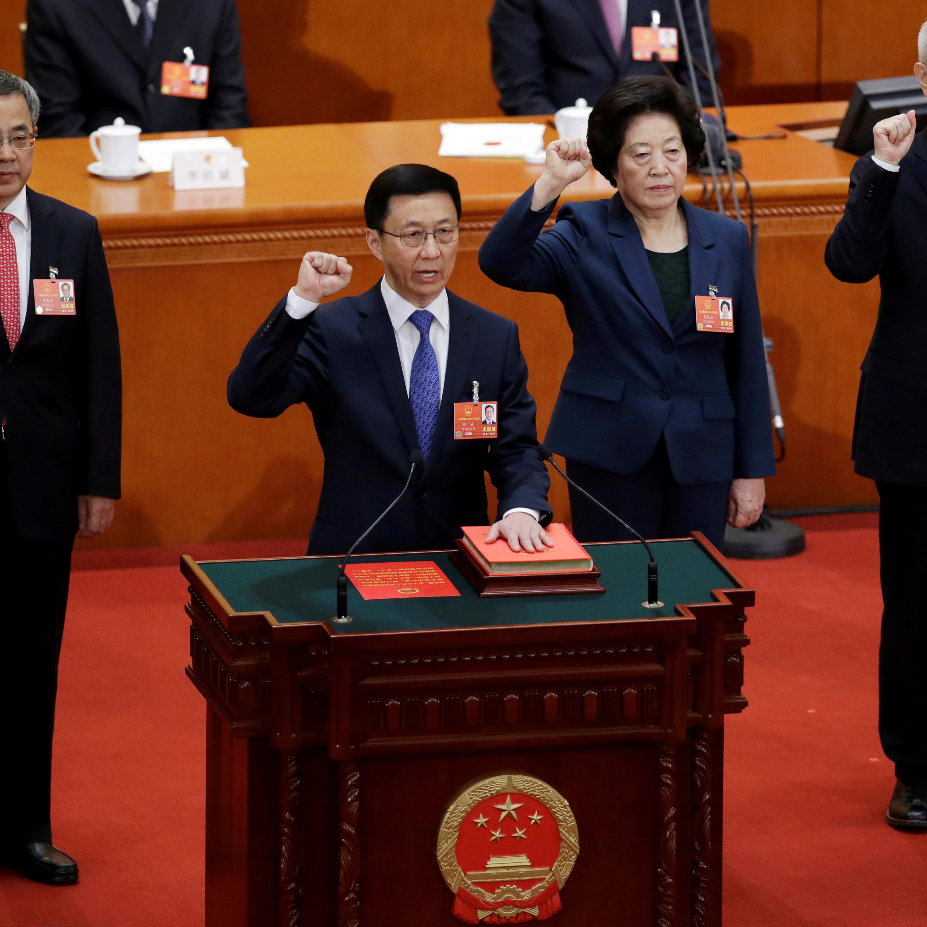 Newly elected Vice Premiers Hu Chunhua, Han Zheng, Sun Chunlan and Liu He take an oath to the constitution at the seventh plenary session of the National People's Congress (NPC)