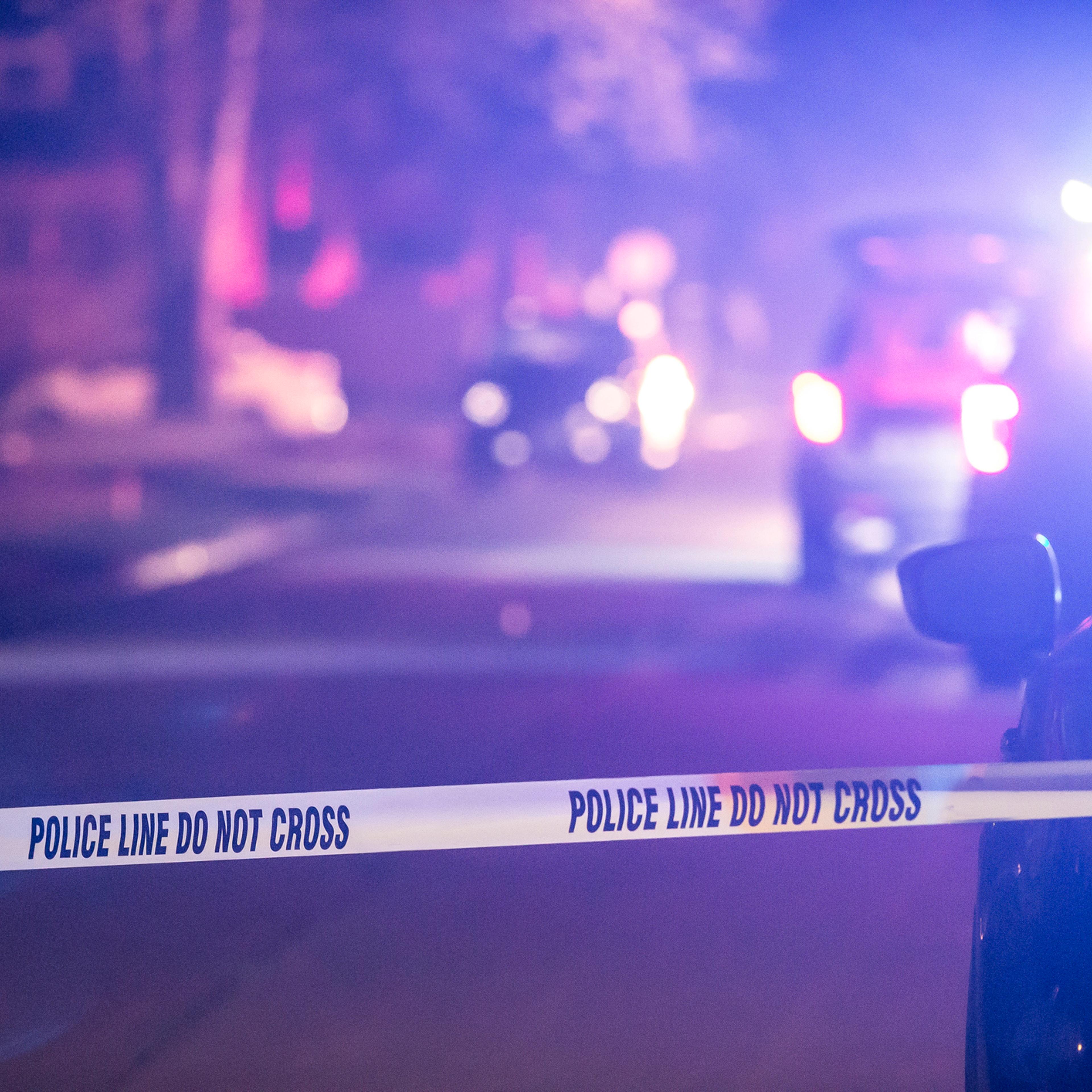 A crime scene is marked off with police tape