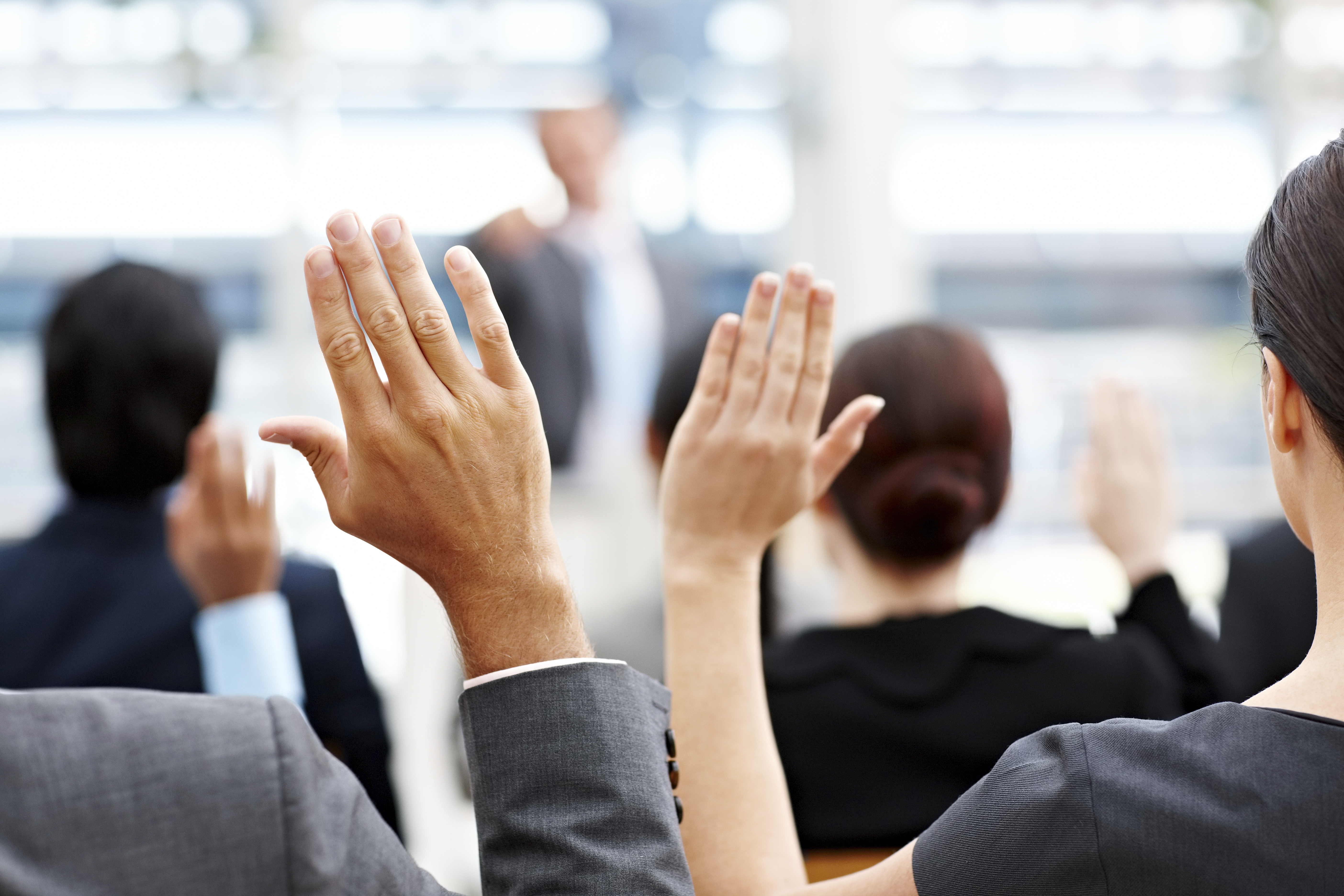 Business People Raising Their Hands