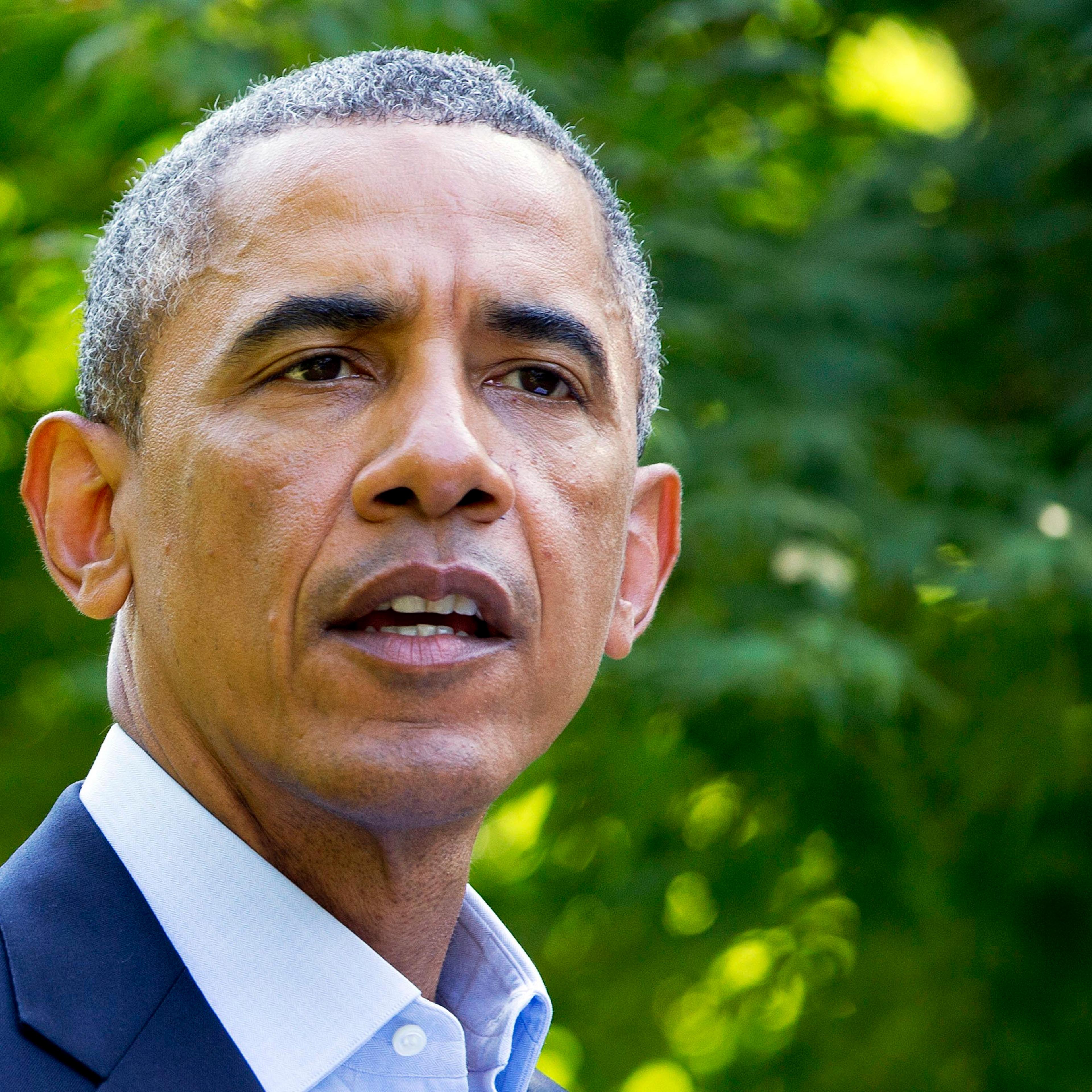 President Barack Obama speaks on Aug. 11, 2014, in Chilmark, Mass., during his family vacation on the island of Martha's Vineyard.