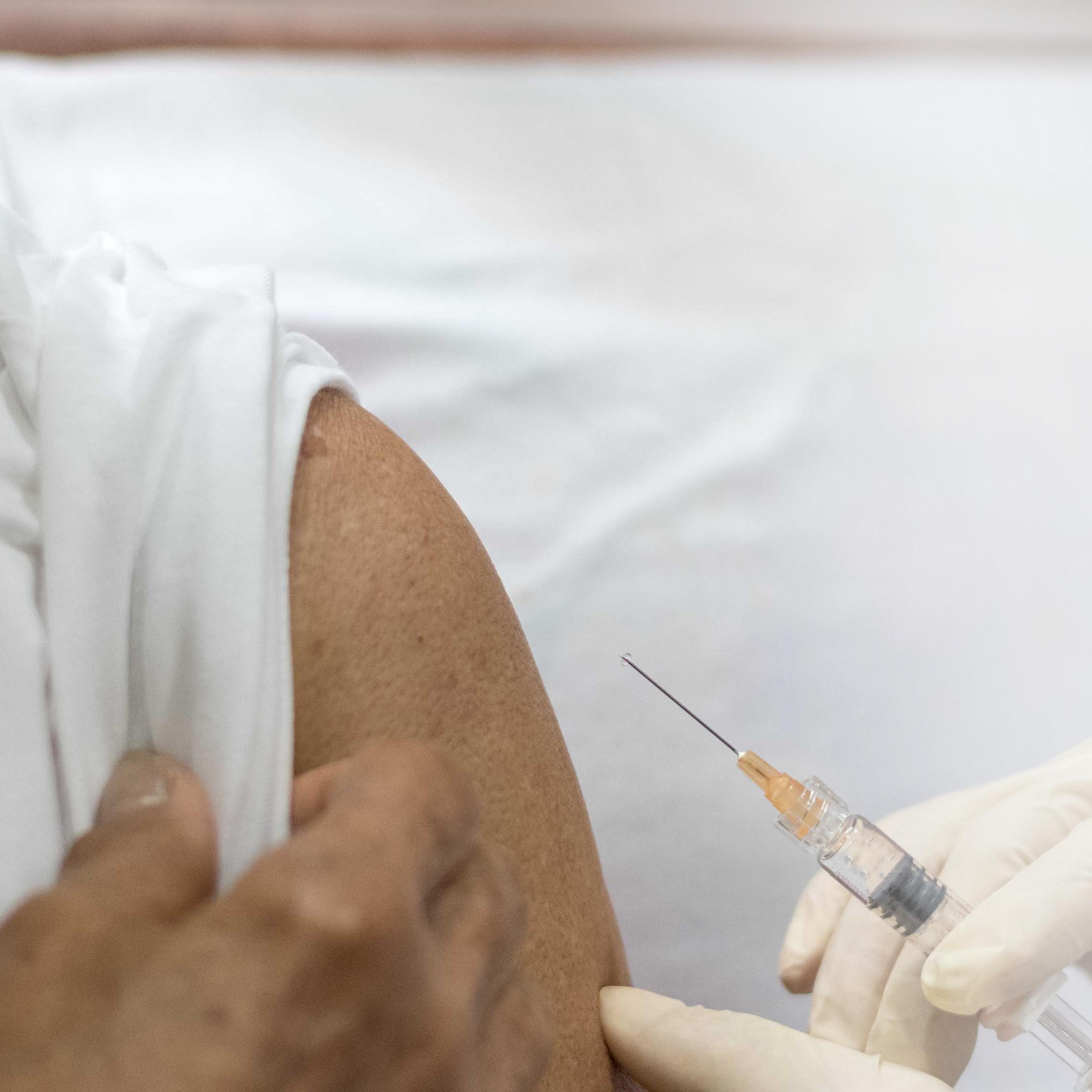 Adult getting a measles shot