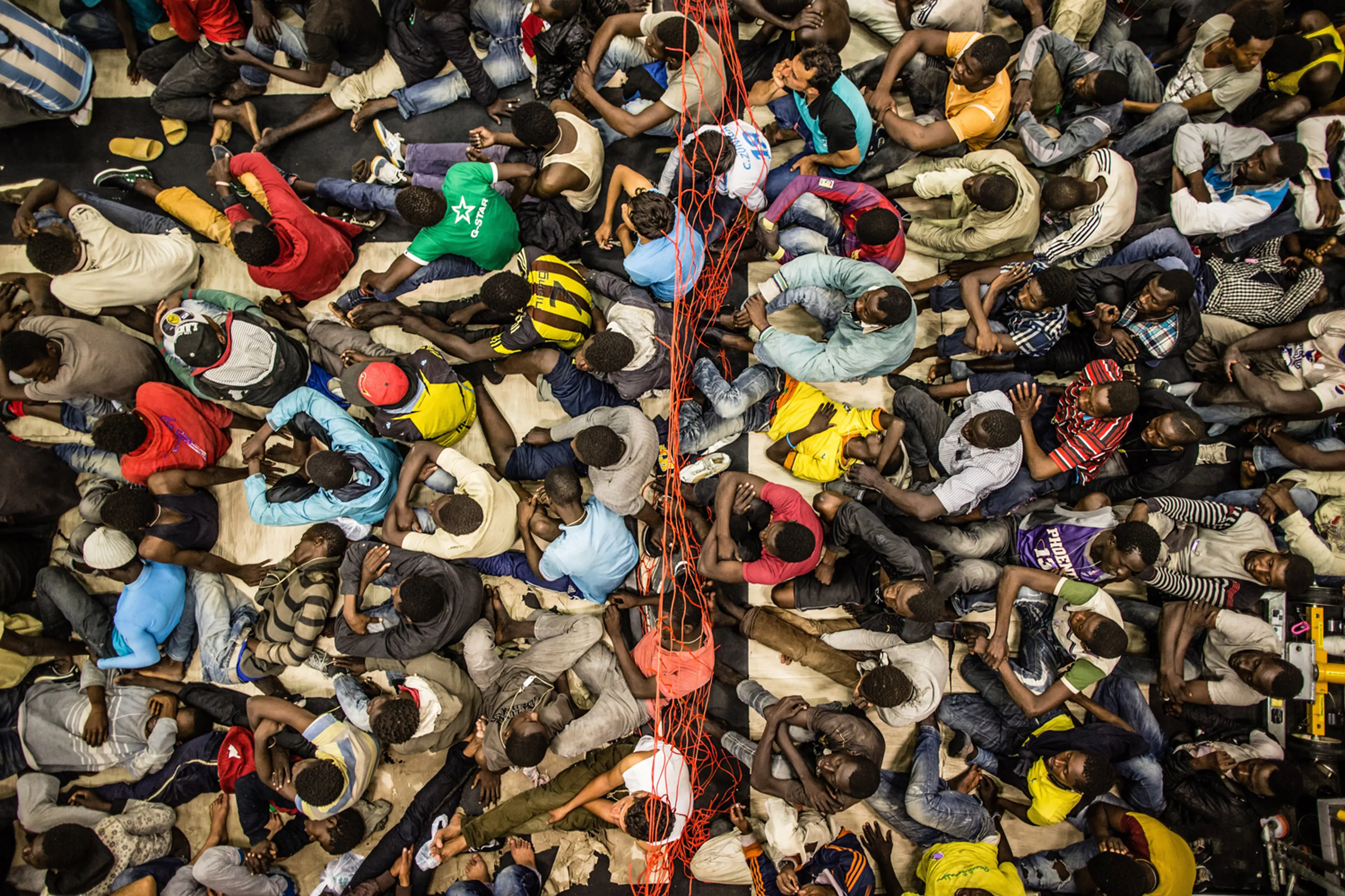 African asylum seekers on board a rescue craft dispatched from an Italian navy ship, June