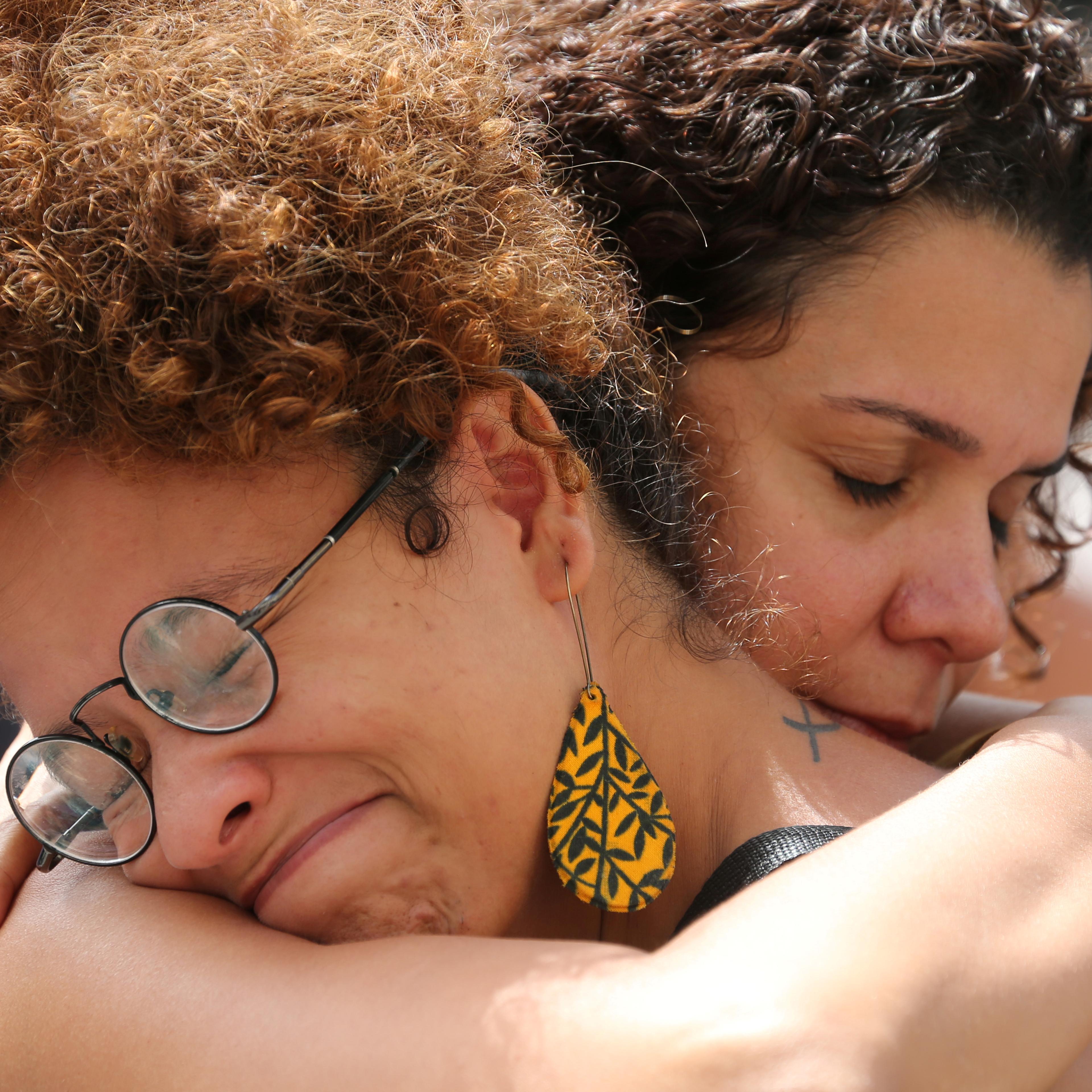 Demonstrators react before the wake of councilwoman Marielle Franco, 38, who was shot dead, in Rio de Janeiro