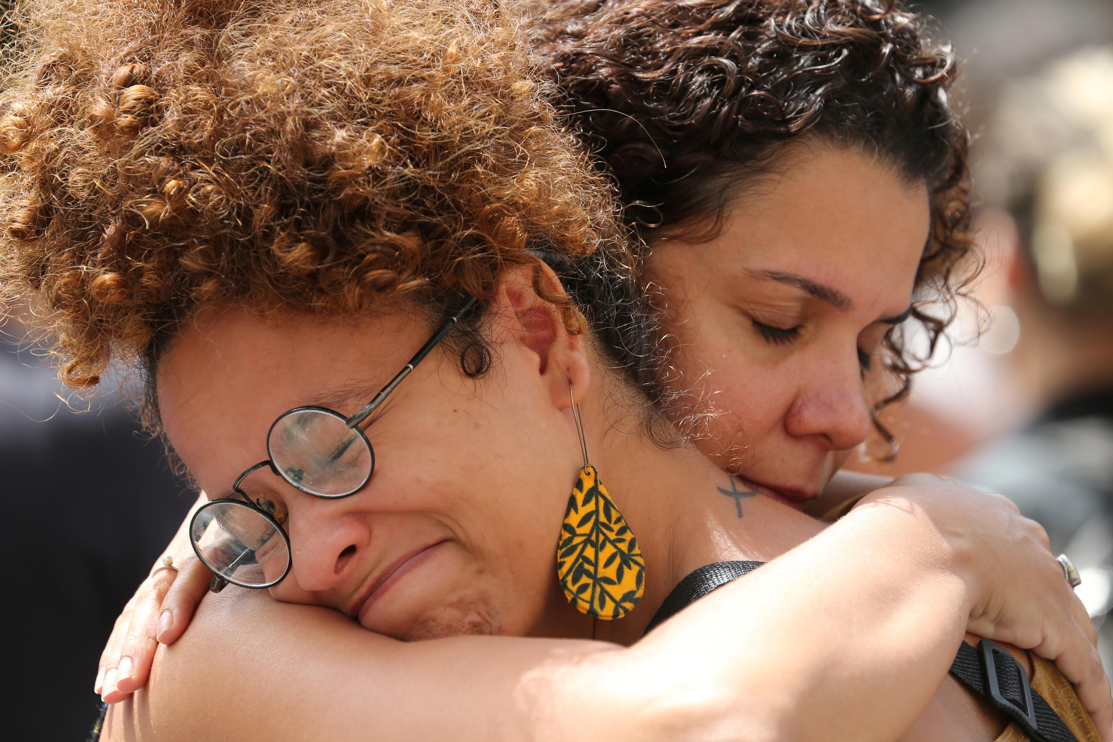 Demonstrators react before the wake of councilwoman Marielle Franco, 38, who was shot dead, in Rio de Janeiro