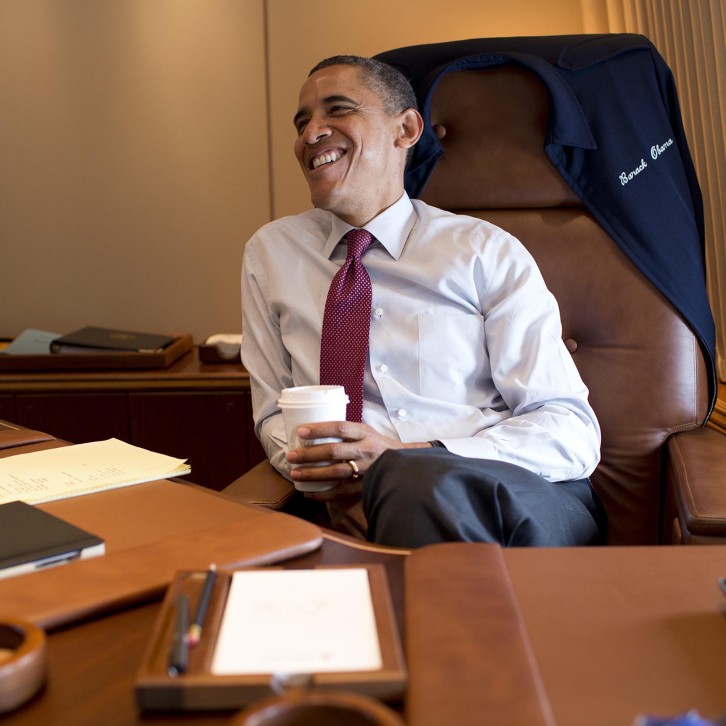 President Obama works in his private office aboard Air Force One.