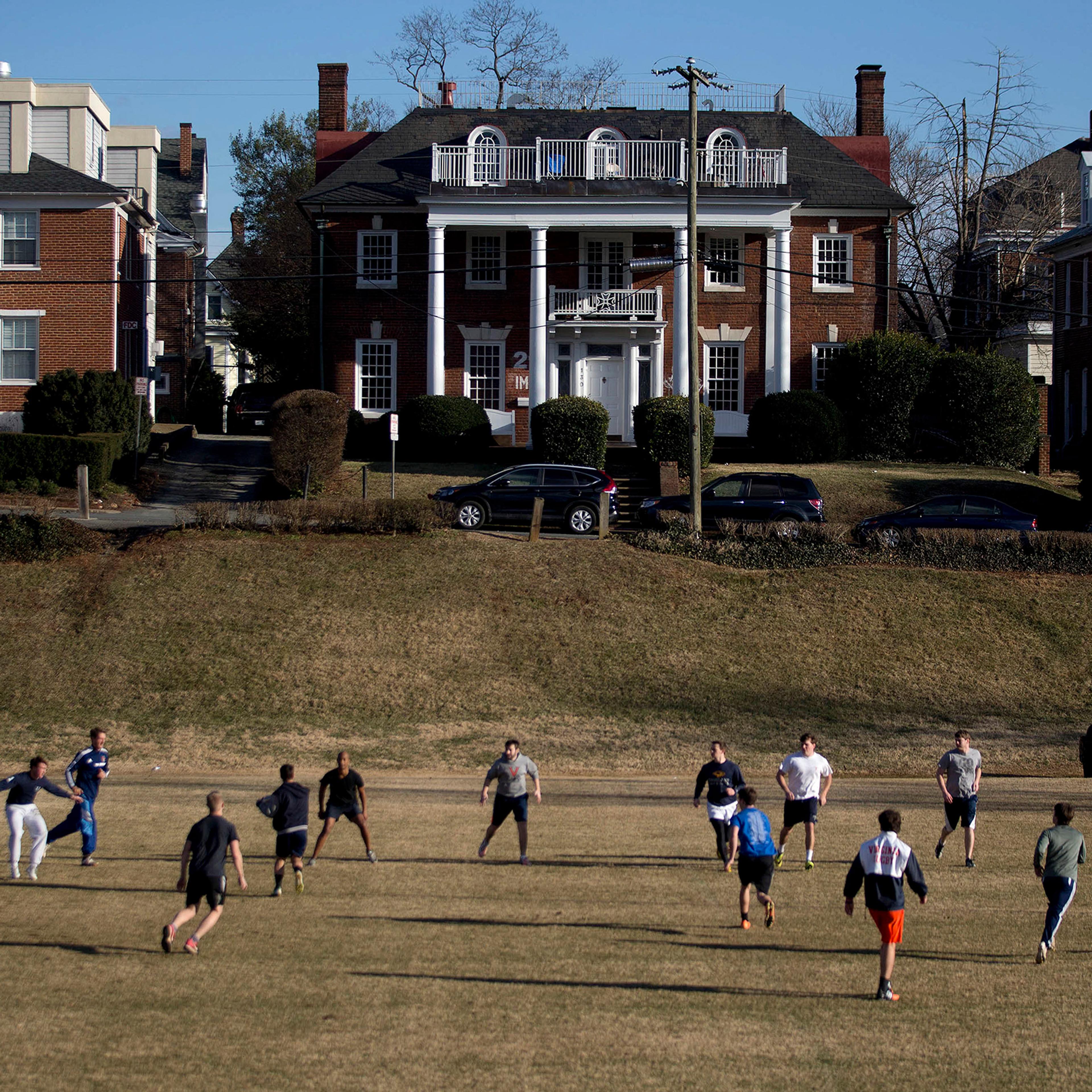 Students play rugby on the Madison Bowl field of the University of Virginia (UVA) campus next to fraternity houses on Madison Lane in Charlottesville, Virginia, Jan. 16, 2015.