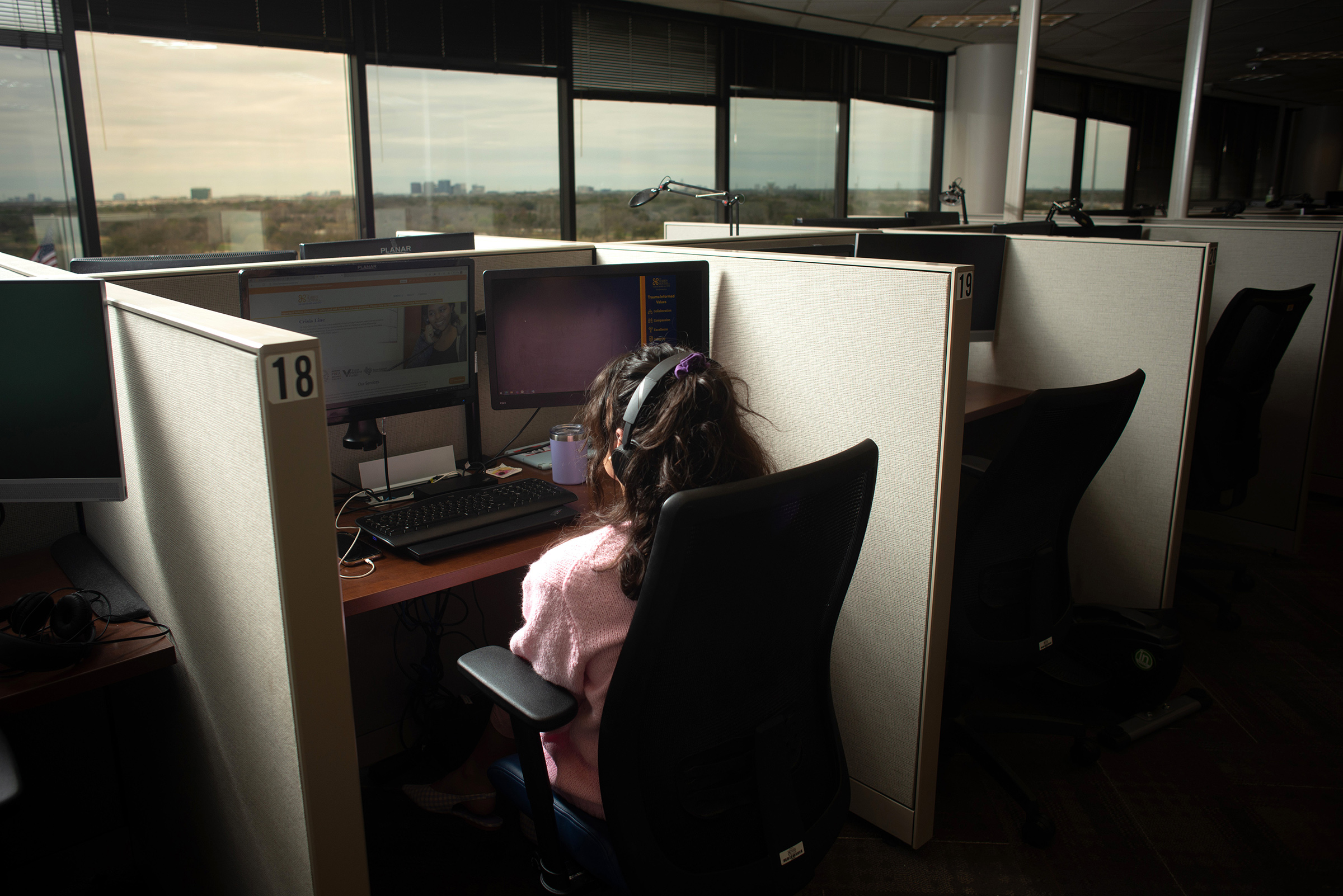 Isabelle Row, a crisis line specialist, at The Harris Center for Mental Health and IDD, in Houston, Texas, on March 7, 2022.
