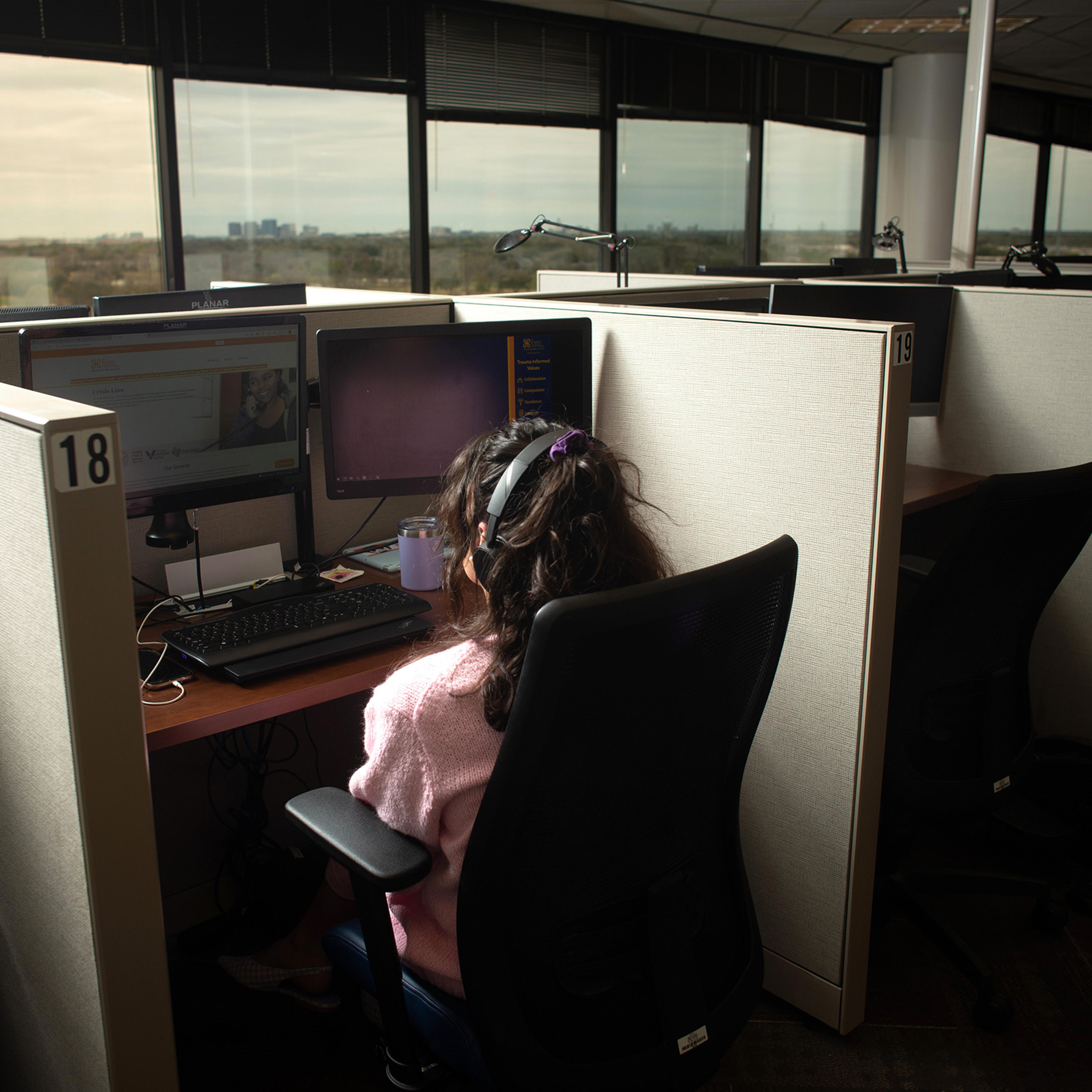 Isabelle Row, a crisis line specialist, at The Harris Center for Mental Health and IDD, in Houston, Texas, on March 7, 2022.