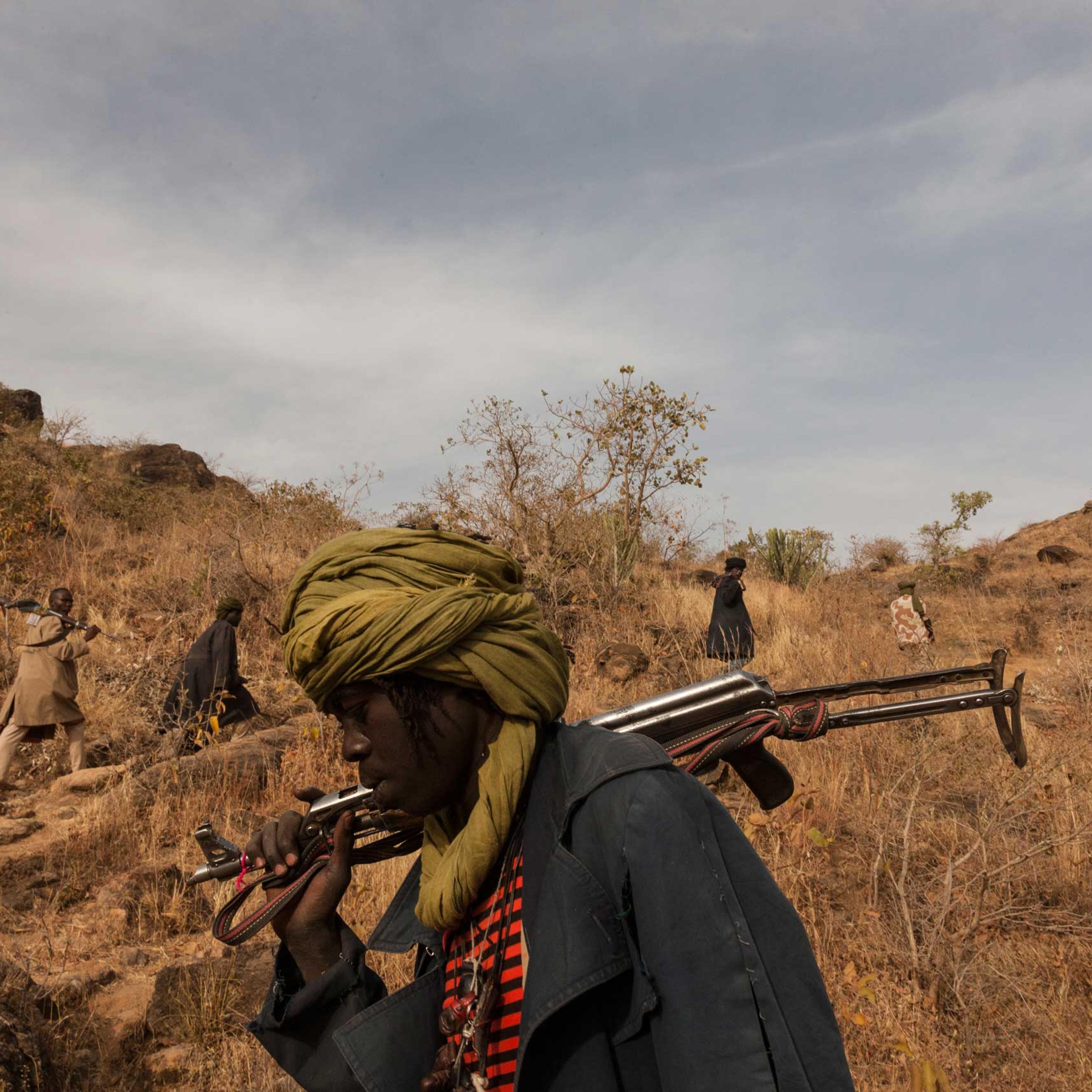 Members of the rebel group Sudan Liberation Army led by Abdul Wahid (SLA-AW) climb towards the front lines in Jebel Marra, Central Darfur, Sudan, on March 4, 2015. The mountainous area has been a stronghold of the SLA-AW since the conflict between the ne