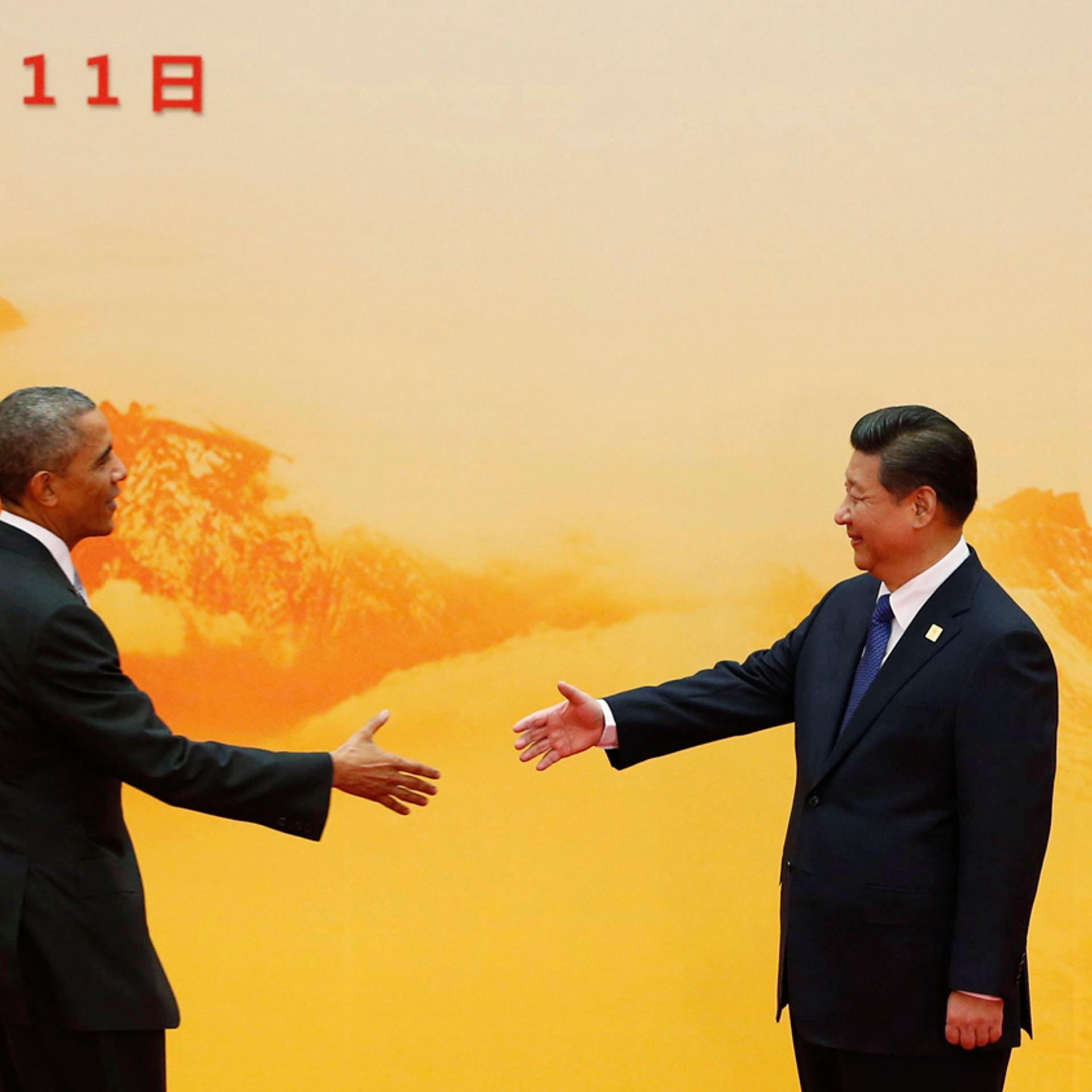 U.S. President Obama shakes hands with China's President Xi during the APEC forum, at the International Convention Center in Beijing