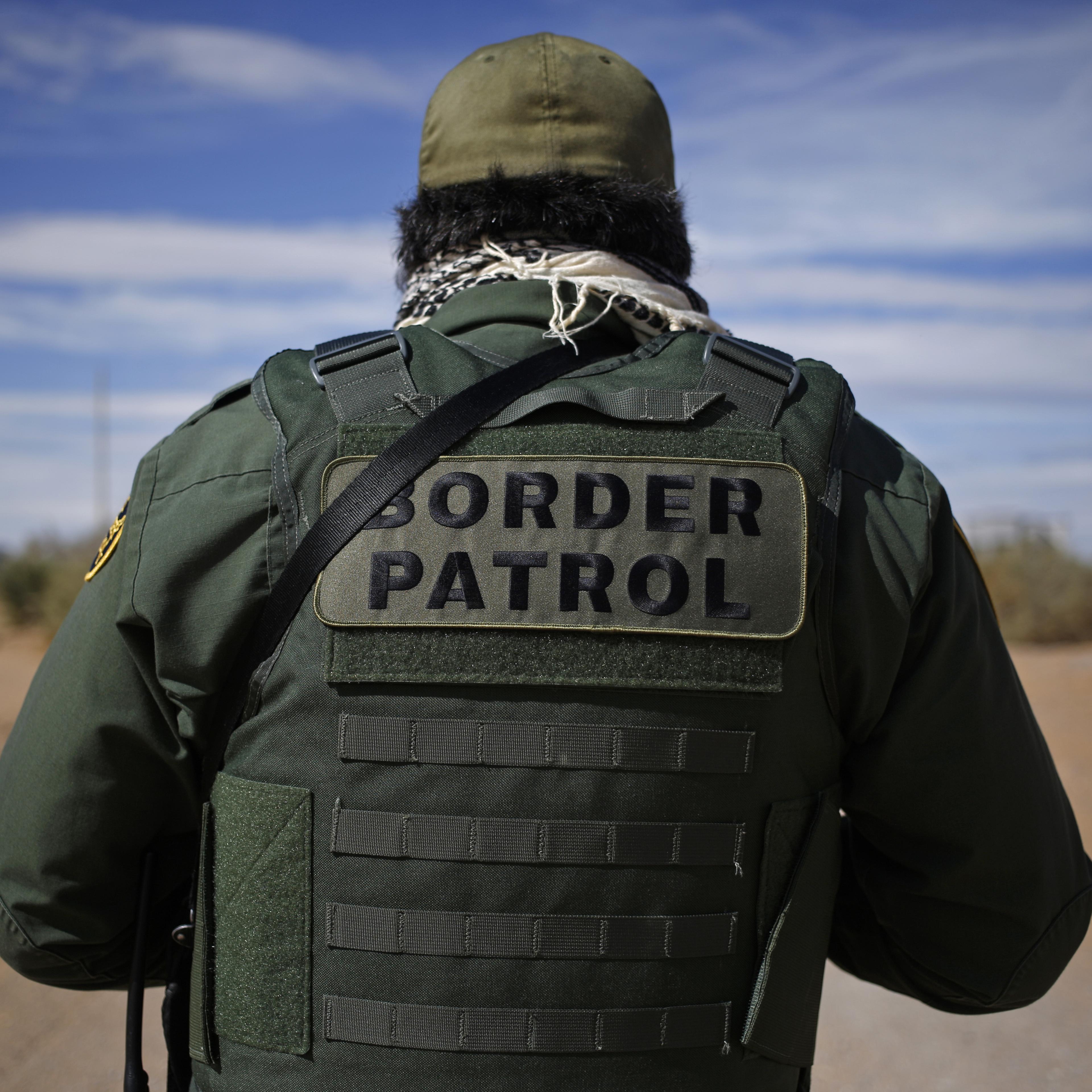 A U.S. Border Patrol agent stands for a photograph while keeping watch along the U.S. and Mexico border in Santa Teresa, New Mexico, U.S., on Friday, Feb. 17, 2017.