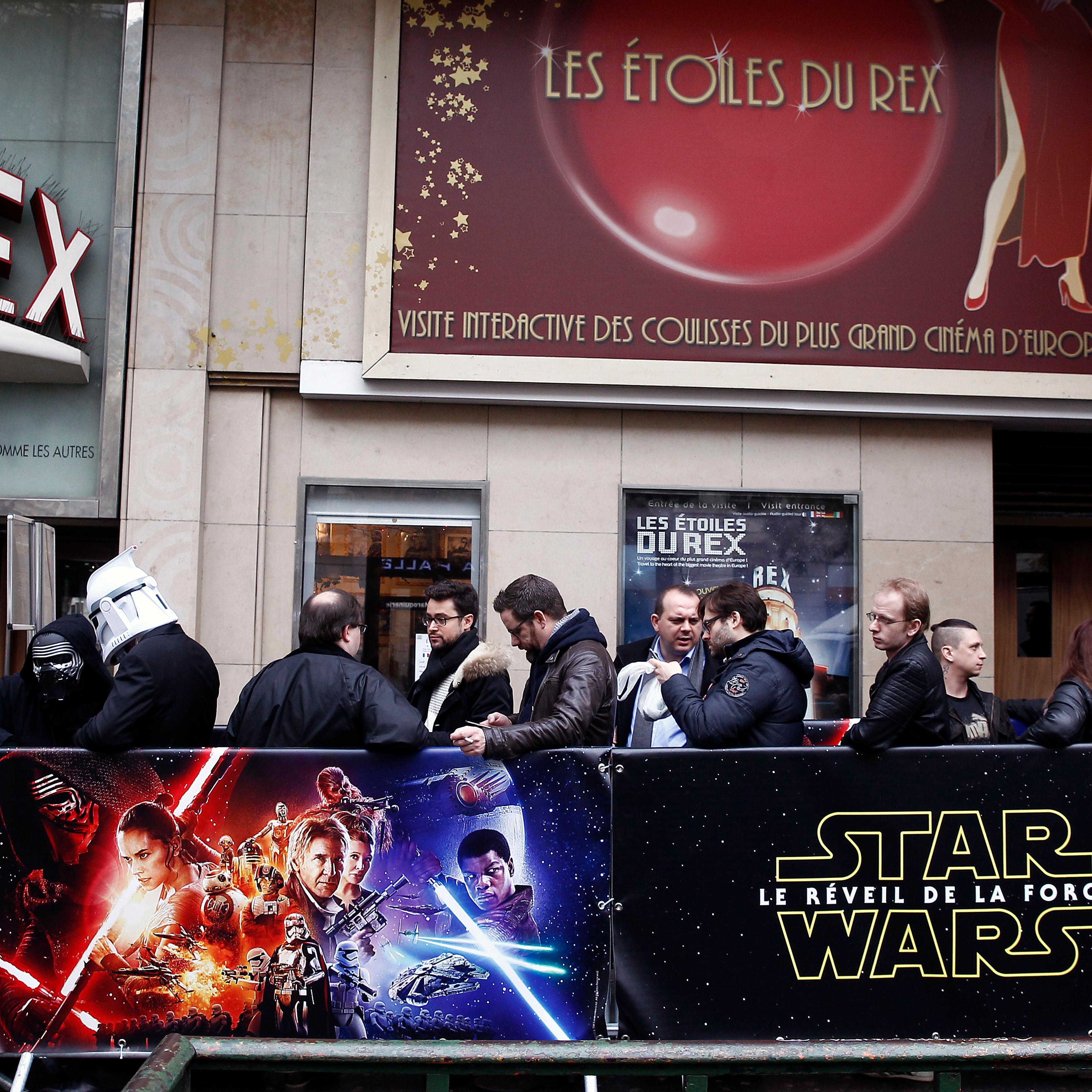Fans dressed in character costumes from "Star Wars" before the public screening of "The Force Awakens" at the Grand Rex cinema on Dec. 16 in Paris.