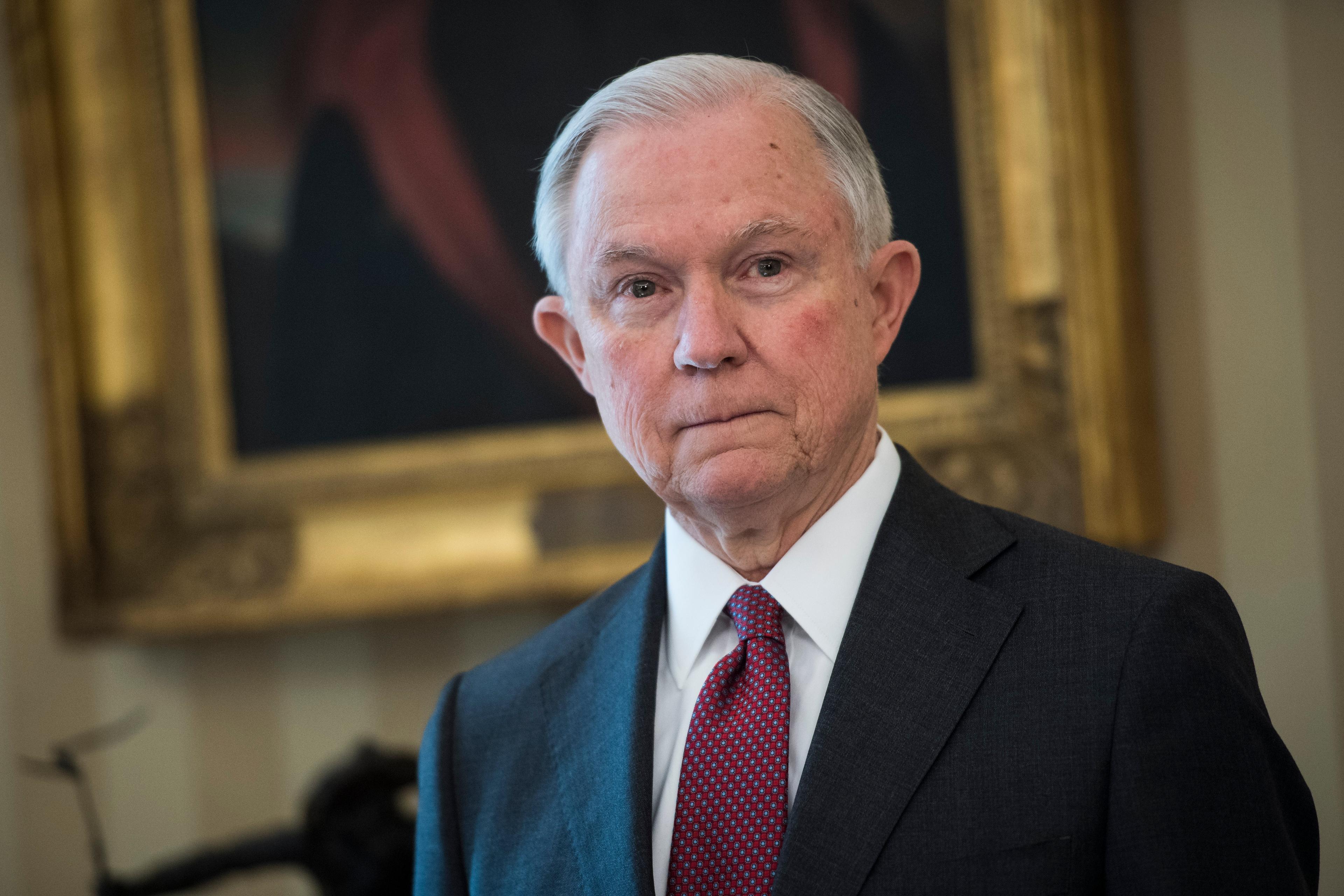 Attorney General Jeff Sessions listens as President Donald Trump speaks during a swearing in ceremony in the Oval Office of the White House in Washington, DC on Thursday, Feb. 08, 2017.