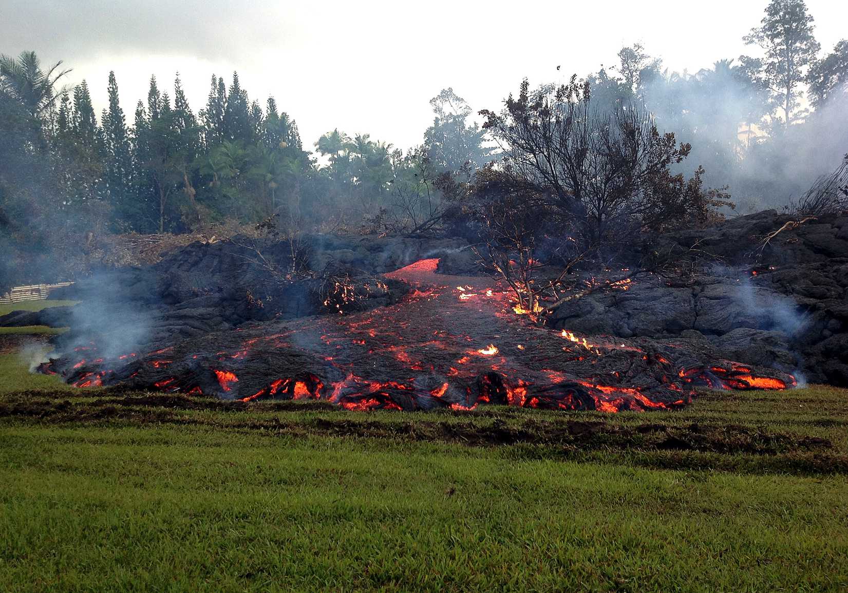 This Nov. 2, 2014 photo provided by the U.S. Geological Survey shows a breakout from an inflated lobe of the June 27 lava flow near the town of Pahoa on the Big Island of Hawaii.