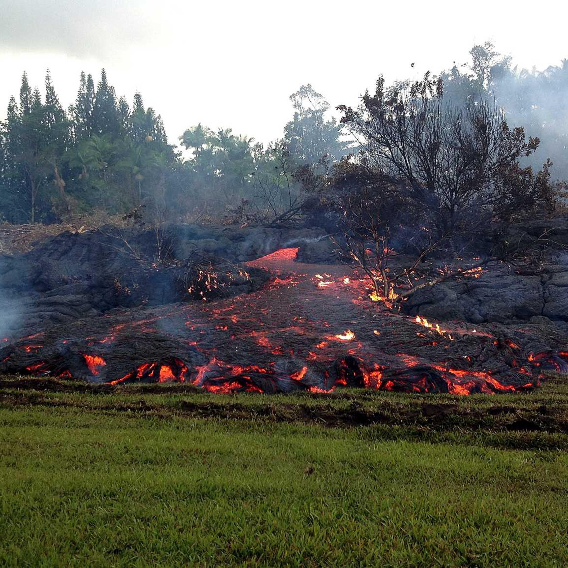 This Nov. 2, 2014 photo provided by the U.S. Geological Survey shows a breakout from an inflated lobe of the June 27 lava flow near the town of Pahoa on the Big Island of Hawaii.