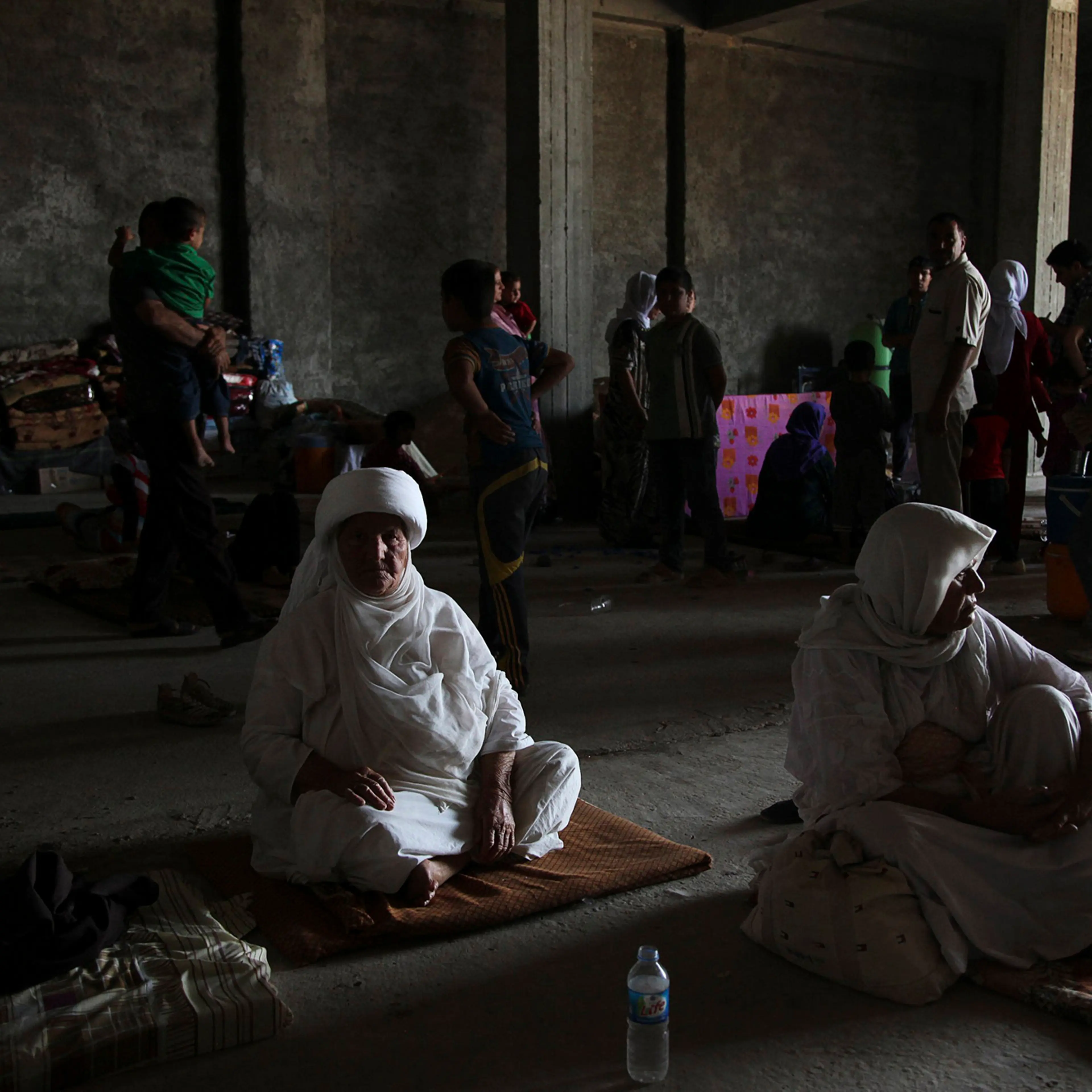 Displaced people from the minority Yazidi sect, fleeing the violence in the Iraqi town of Sinjar west of Mosul, take refuge at Dohuk province, Aug. 7, 2014.