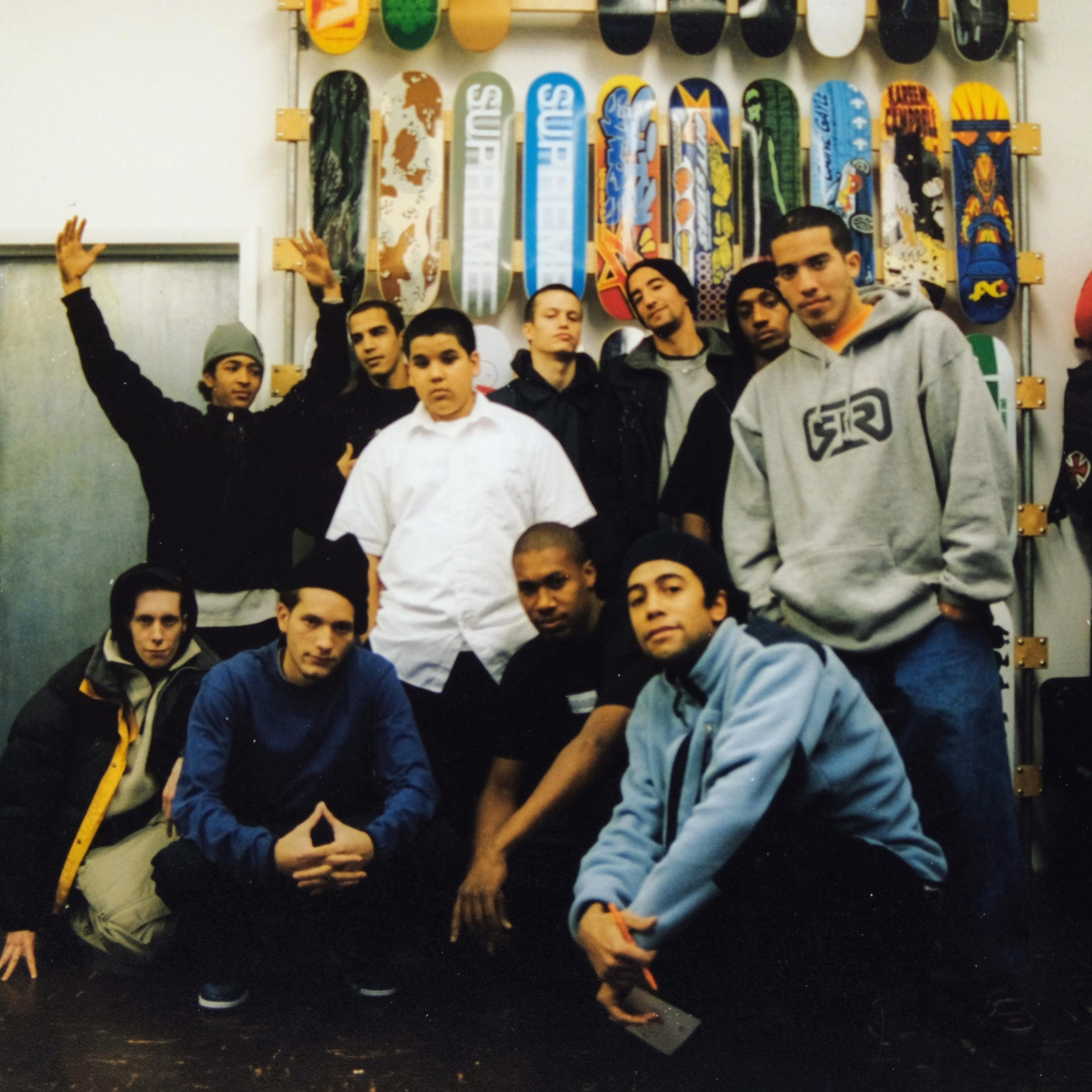 Staff and friends hang out at the shop in the early days of Supreme at its original location on Lafayette Street.
