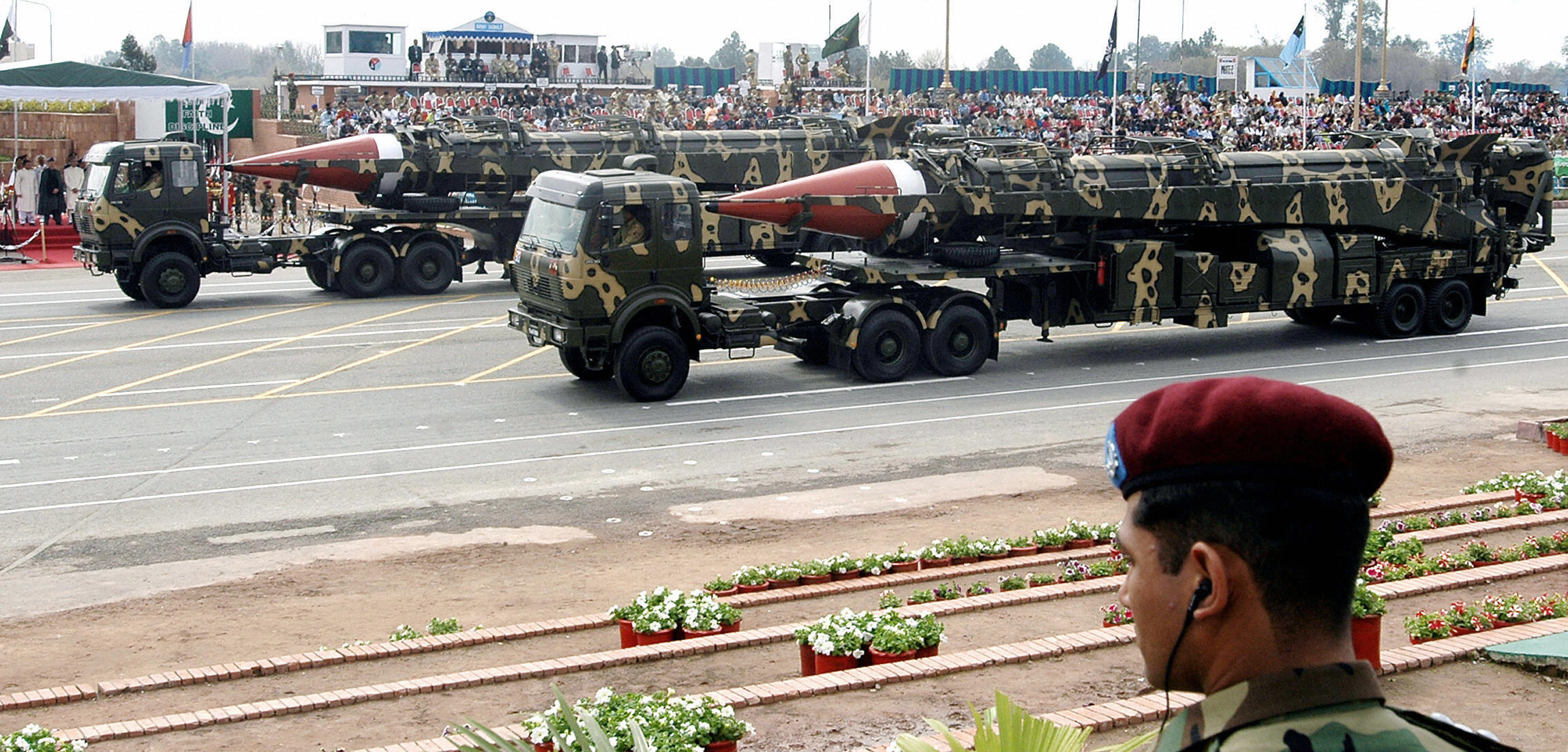 A Pakistani commando (R) looks on as Gha