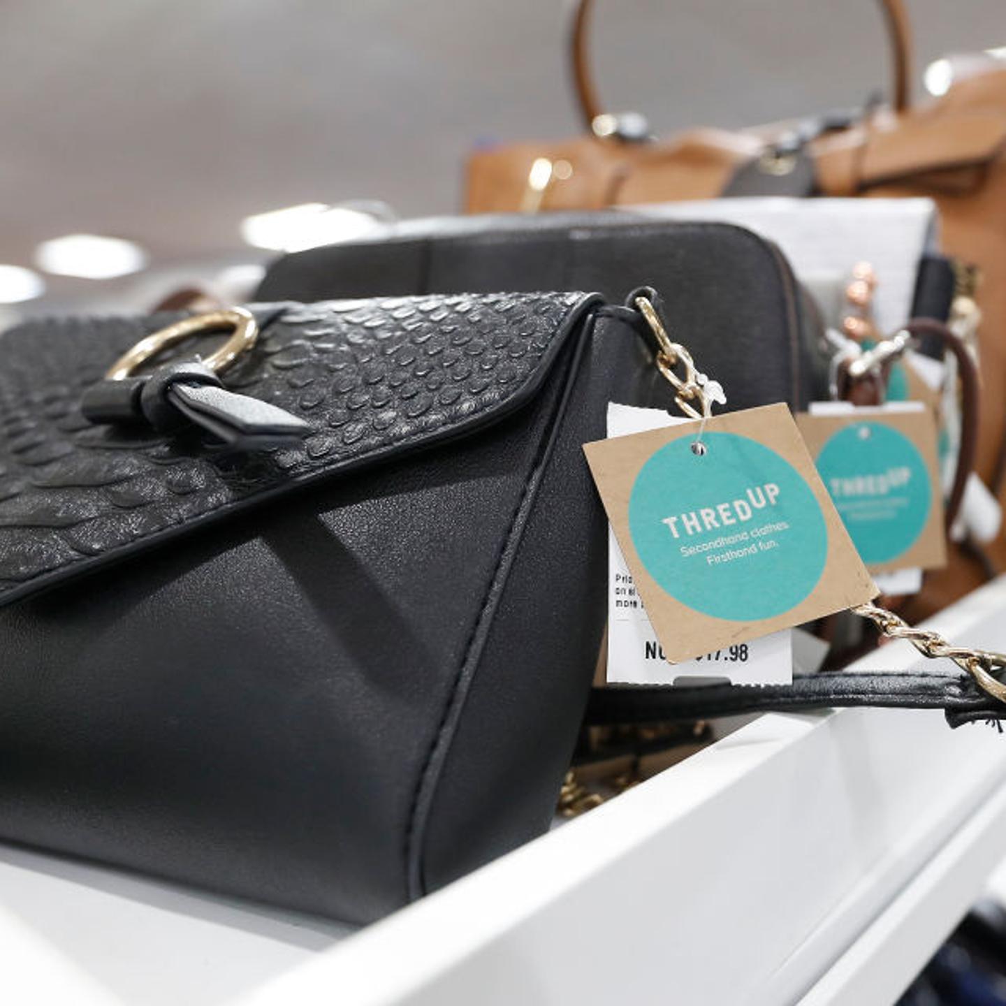Detail of tags on handbags, used and gently-used for sale at the ThredUp pop-up shop inside of the Palais Royal store, in Houston, Texas, on Nov. 21, 2018.