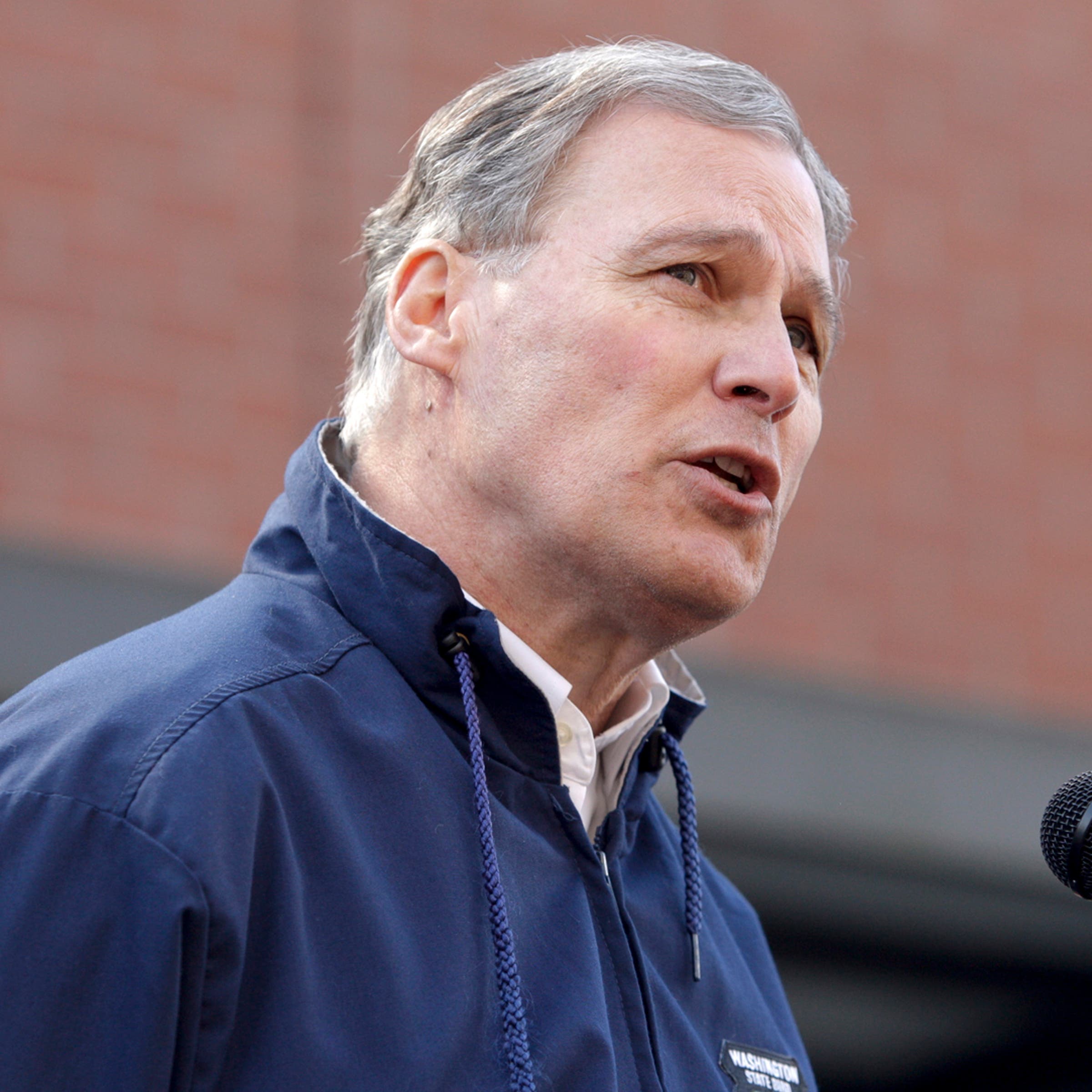 Governor Jay Inslee addresses the media outside the Arlington Police Department in Arlington, Washington