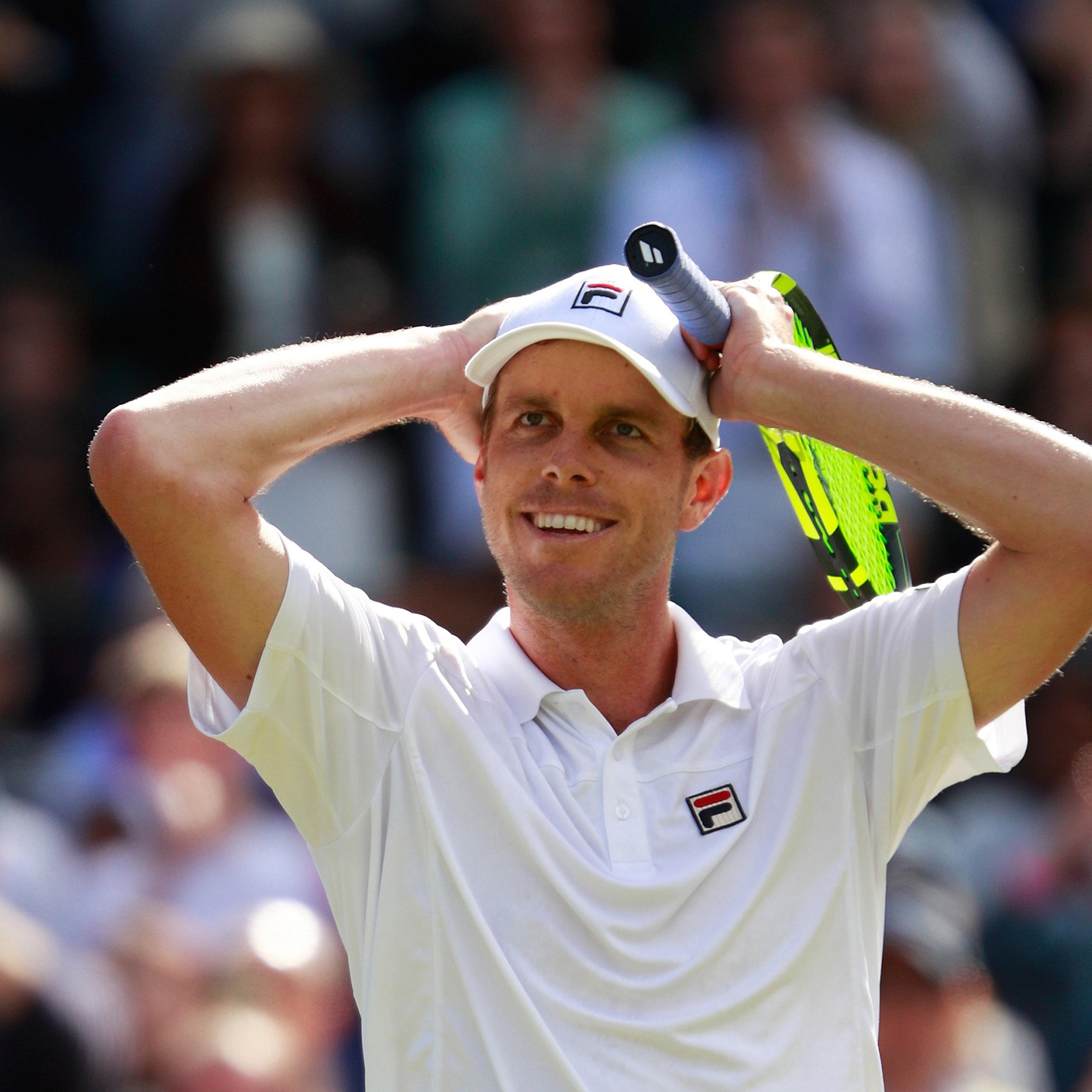 Sam Querrey of the United States celebrates victory during the Men's Singles third round match against Novak Djokovic of Serbia on day six of the Wimbledon Lawn Tennis Championships in London on July 2, 2016.