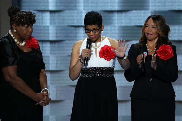 Mothers of the Movement Geneva Reed-Veal (C), mother of Sandra Bland delivers remarks as Lucia McBath (R), mother of Jordan Davis; and Gwen Carr, mother of Eric Garner look on during the second day of the Democratic National Convention at the Wells Fargo