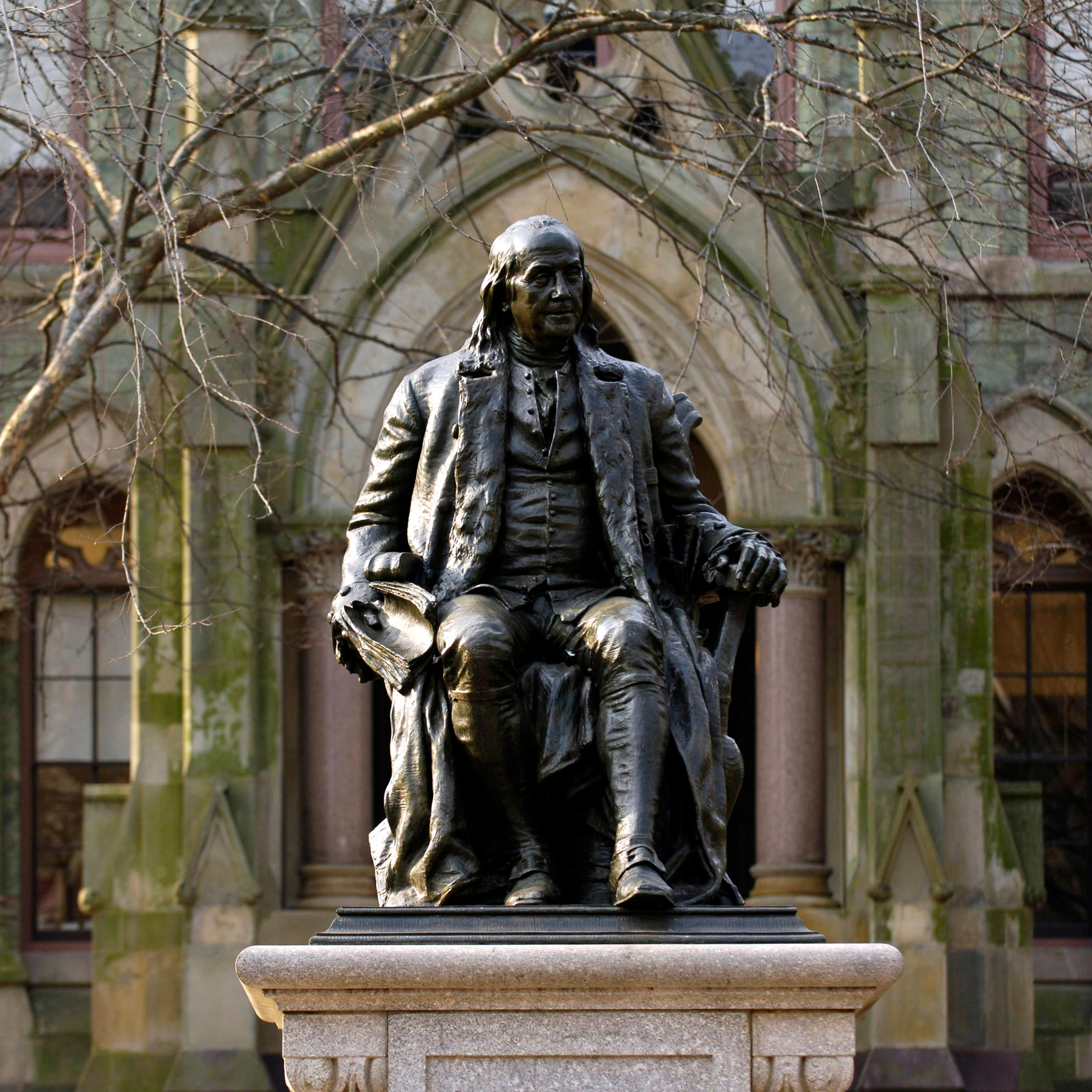 A statue of Benjamin Franklin, founder of the University of