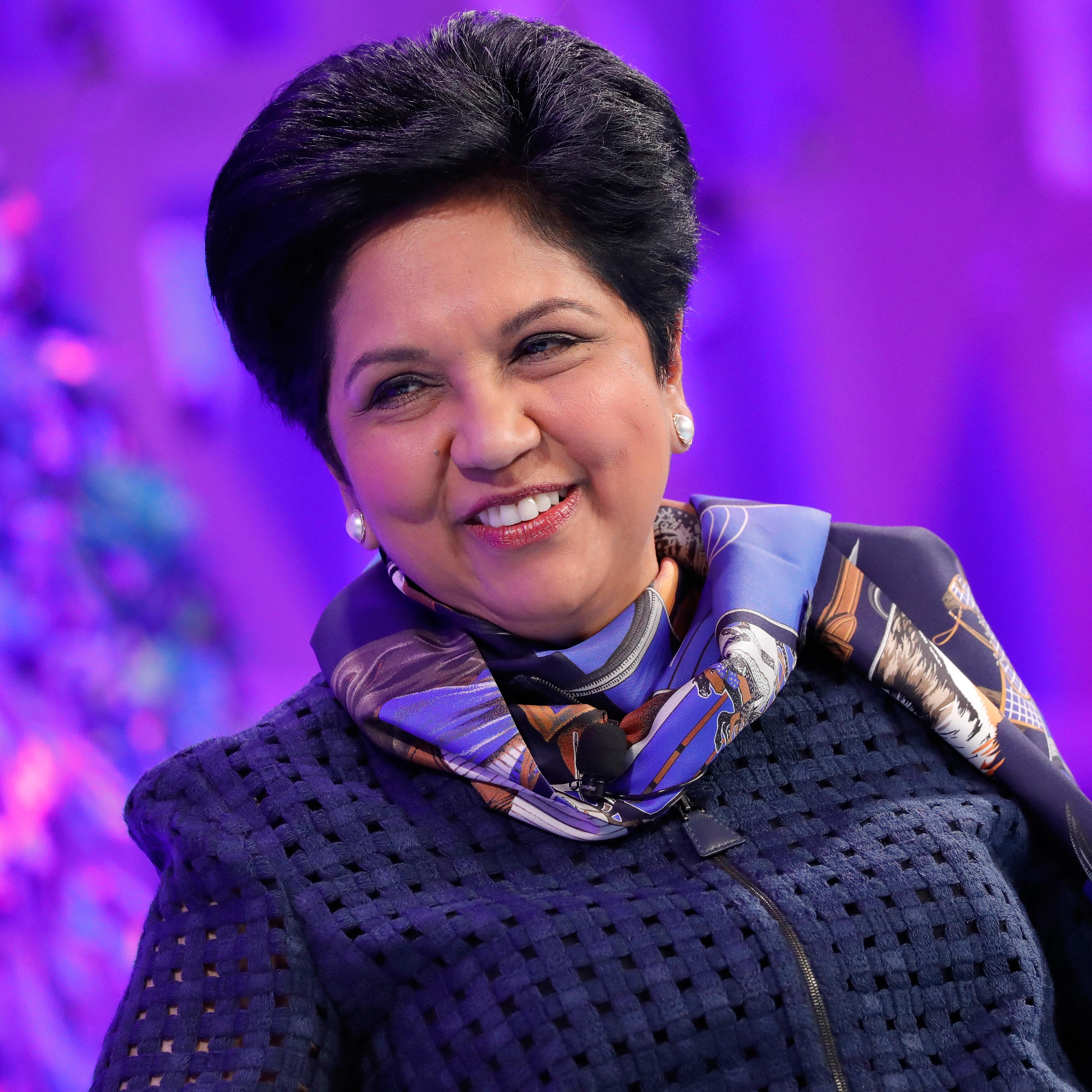 Indra Nooyi smiles at a conference