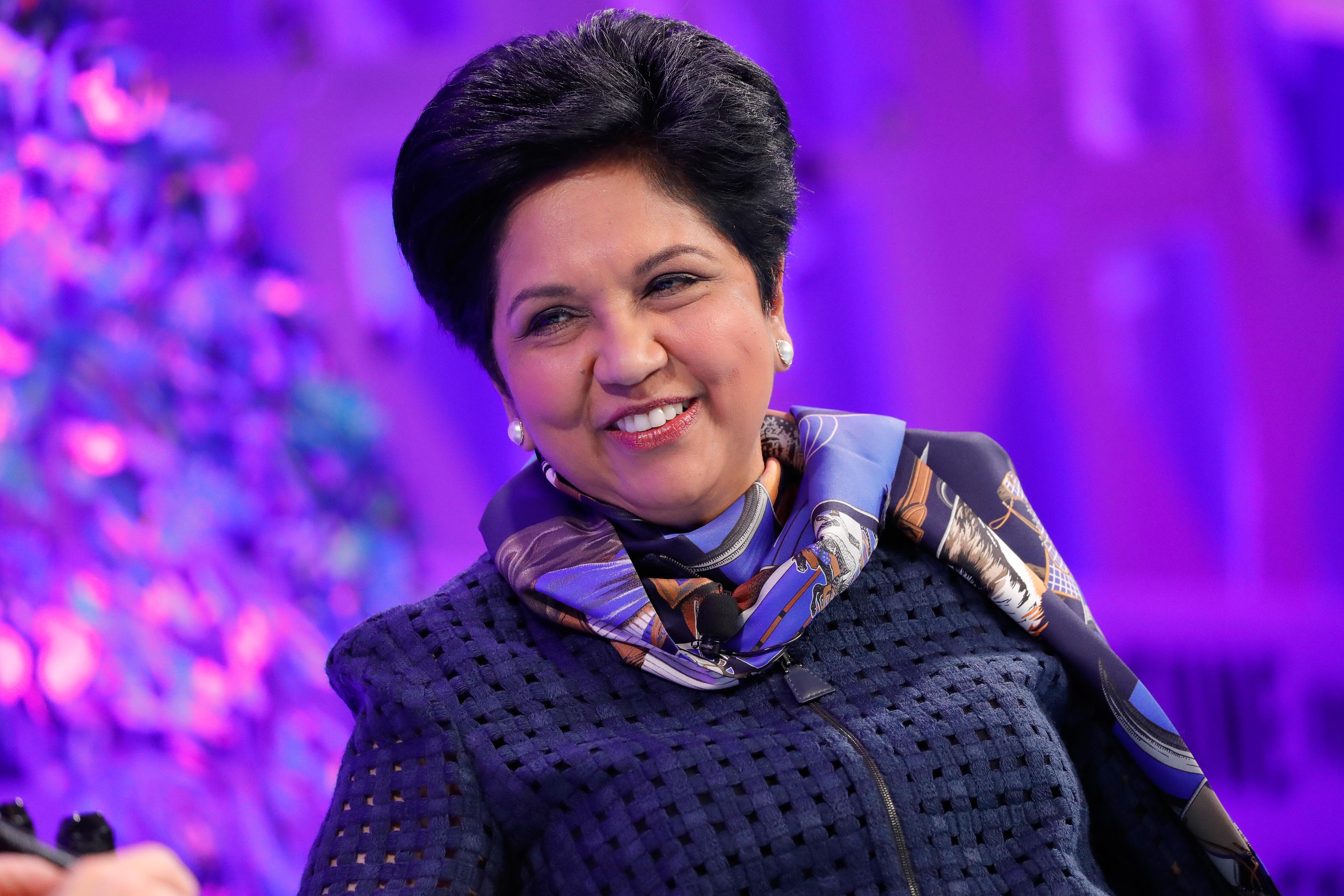 Indra Nooyi smiles at a conference
