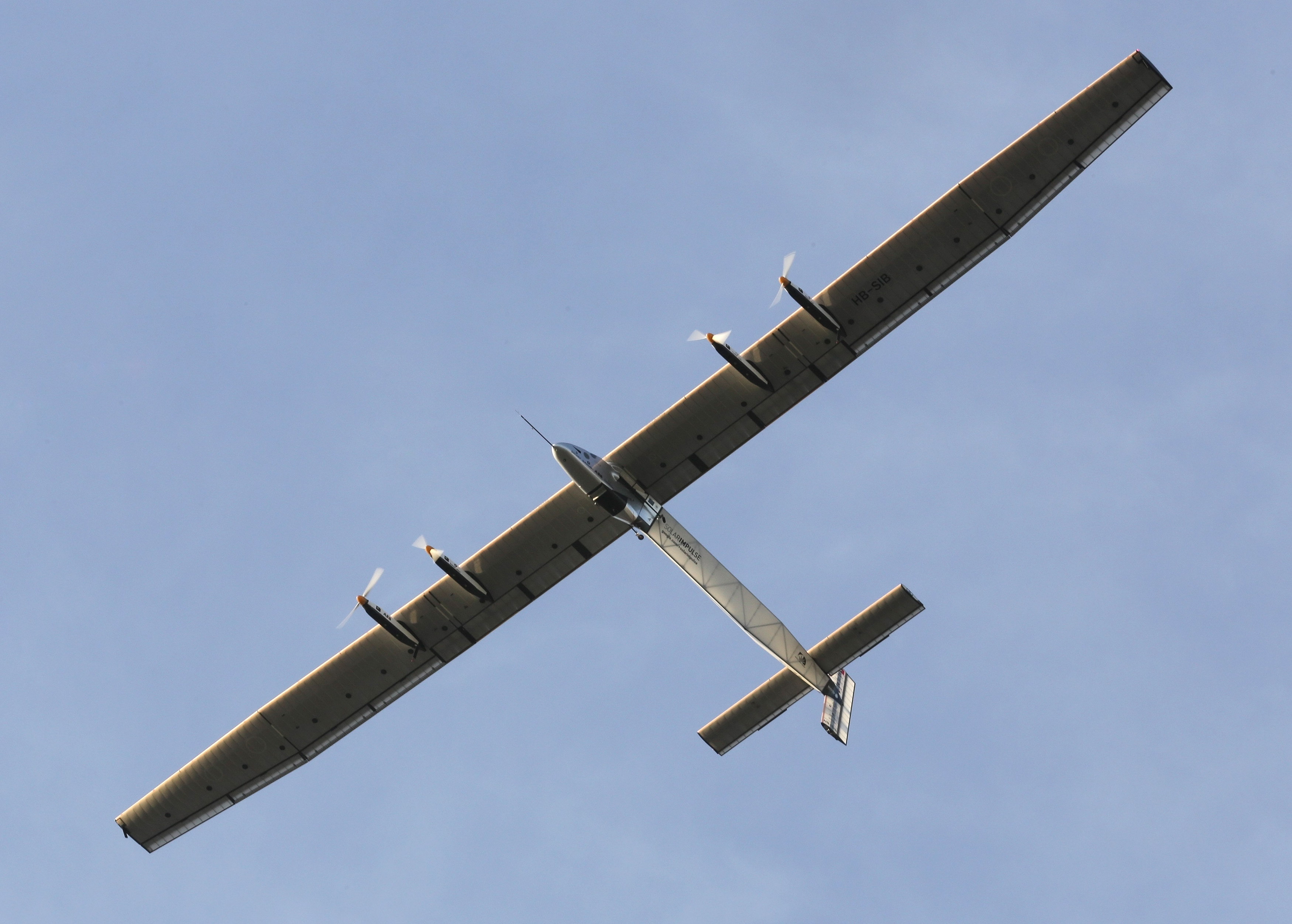 The "Solar Impulse 2", a solar powered plane, is seen on flight after taking off at the airport in Ahmedabad