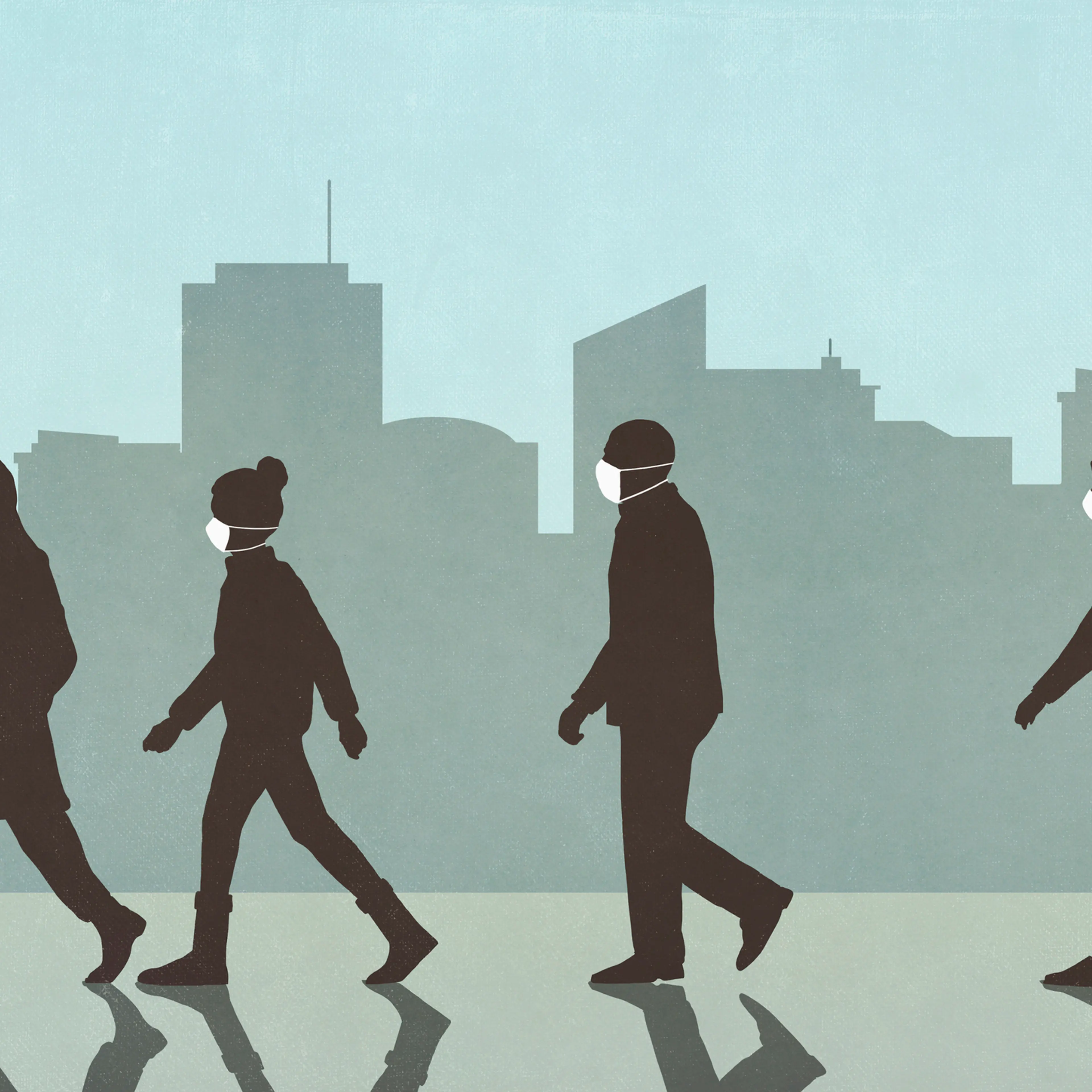 Pedestrians in masks walking in city