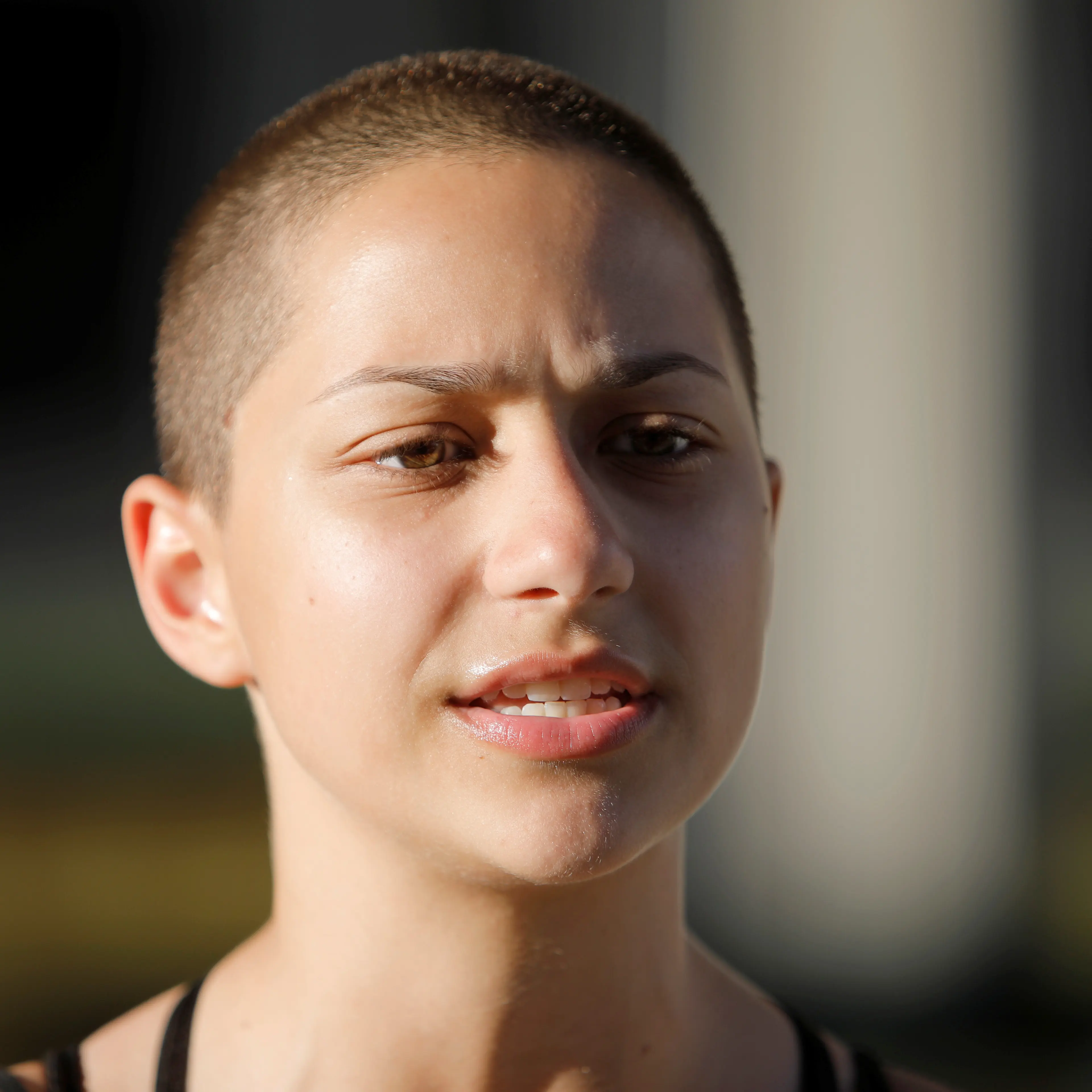Emma Gonzalez, a senior at Marjory Stoneman Douglas High School, speaks to the media after calling for more gun control at a rally three days after the shooting at her school, in Fort Lauderdale