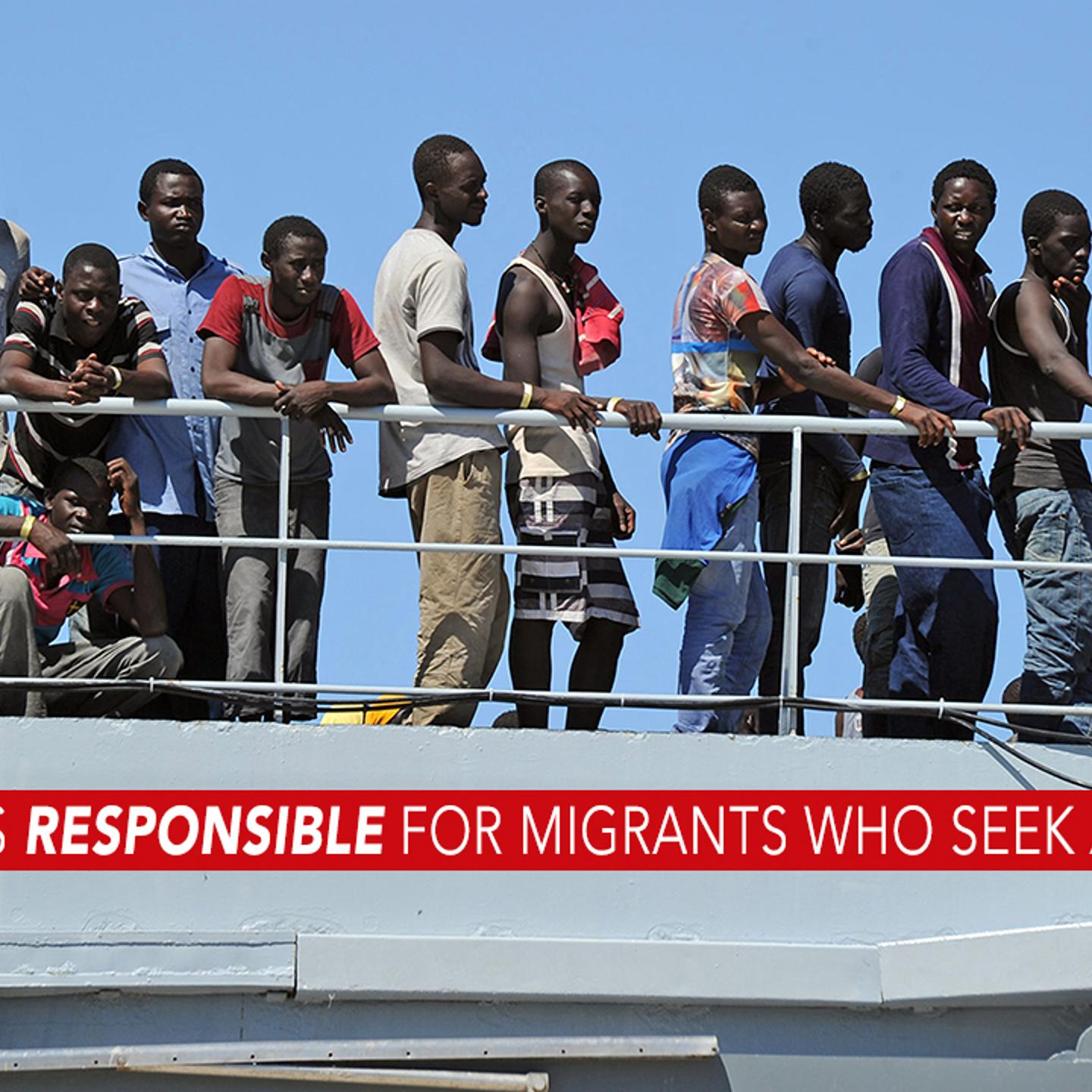 Immigrants, part of a group of more than 1,700 people, wait after they disembarked from the Italian military ship 'San Giusto' on August 11, 2014 in the port of Reggio Calabria, southern Italy, following Mare Nostrum rescue operations at sea. The Italian